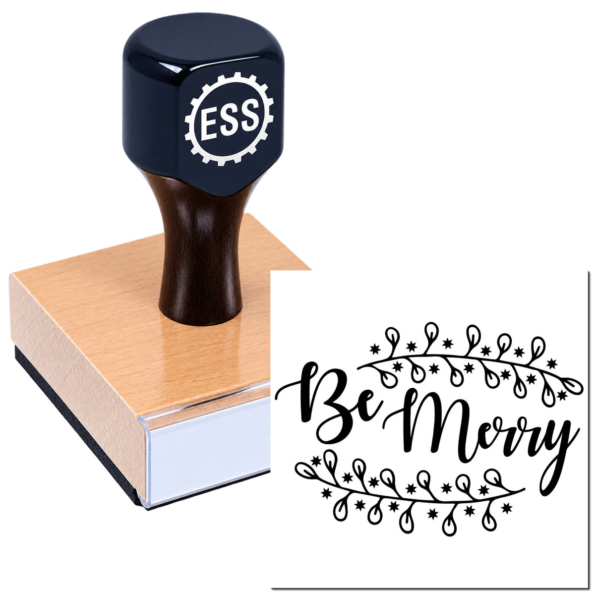 Navy rubber stamp with ESS logo on a wood block beside a black Be Merry decorative seal design