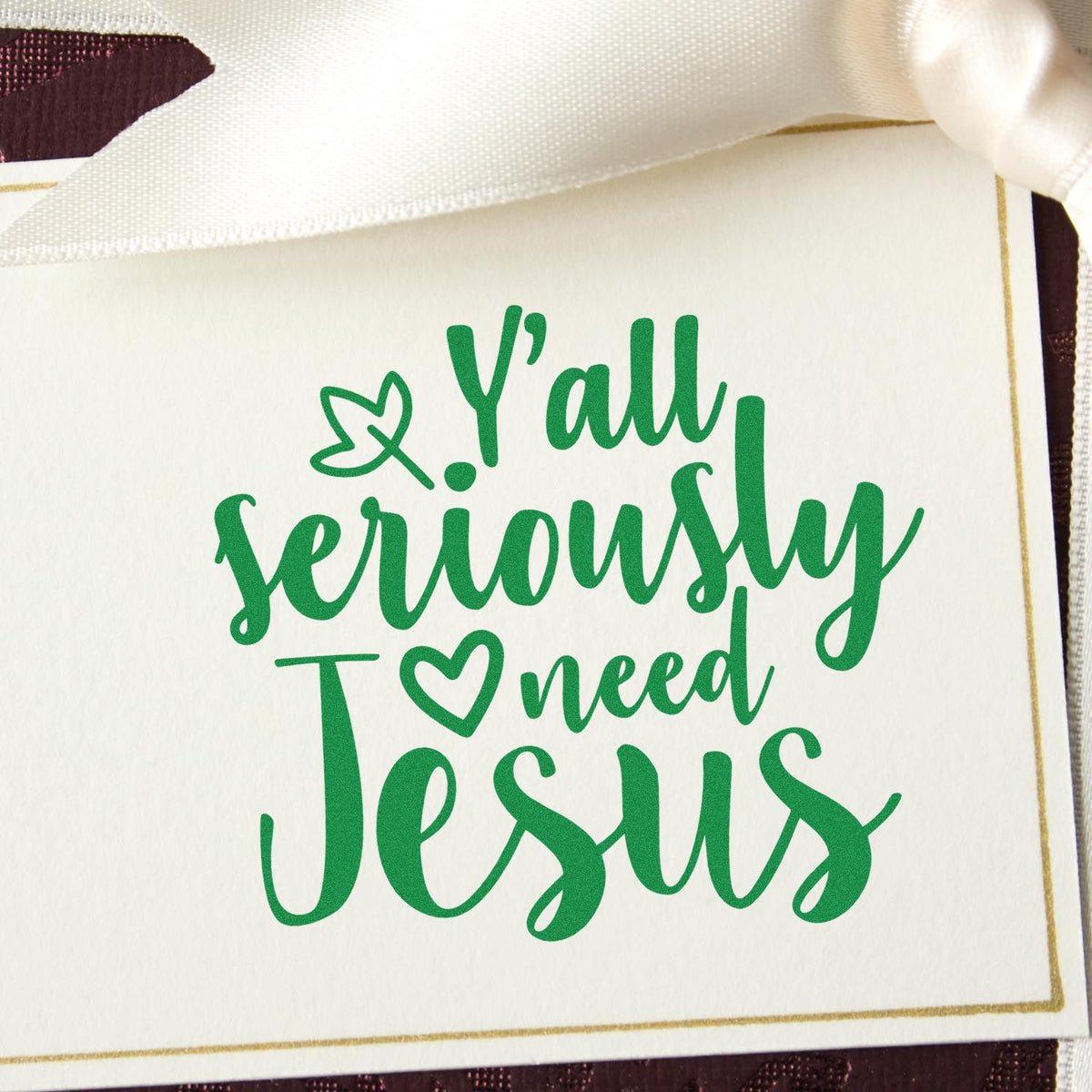 Custom green stamp/seal on white card reading Yall seriously need Jesus, with heart and leaf accents.