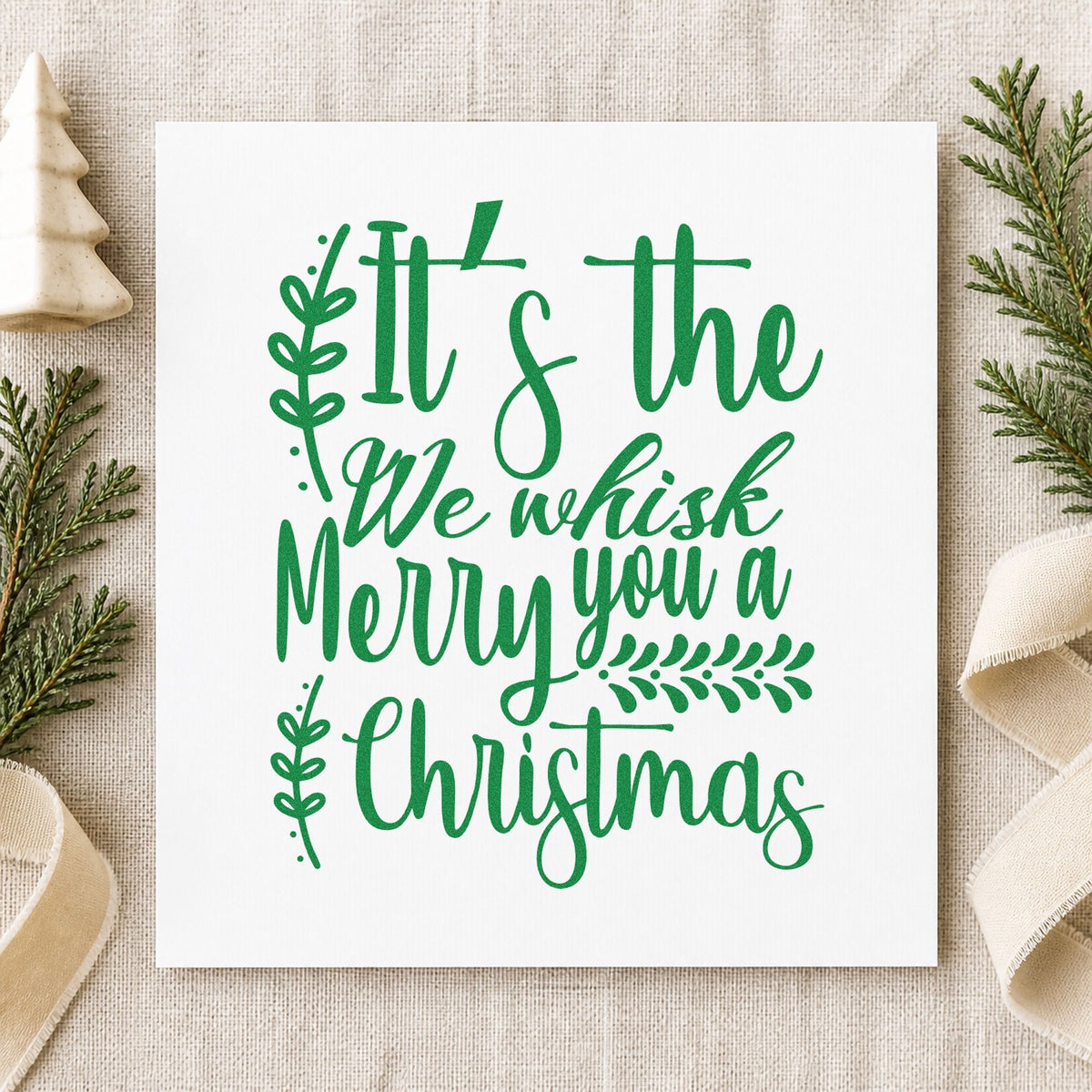 We Whisk Merry Christmas craft stamp imprinted in green ink on paper, a design suited to framed mixer nook.