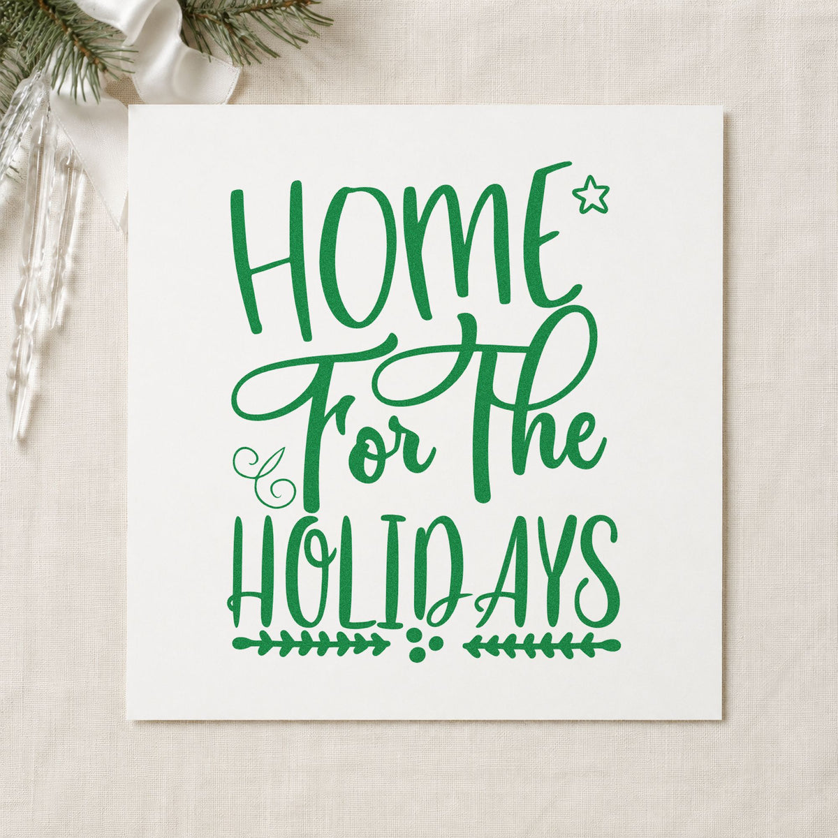 Home For The Holidays craft stamp imprint in green ink on a handmade project, one idea being luggage gift tags.
