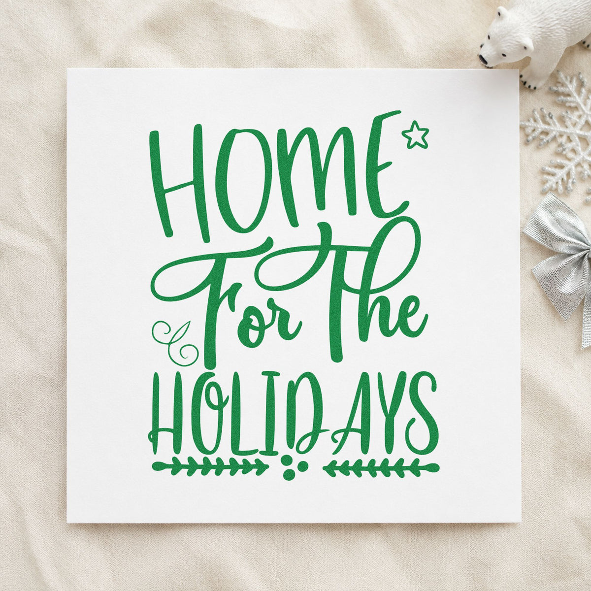 Home For The Holidays craft stamp imprint in green ink on a handmade project, one idea being welcome note cards.