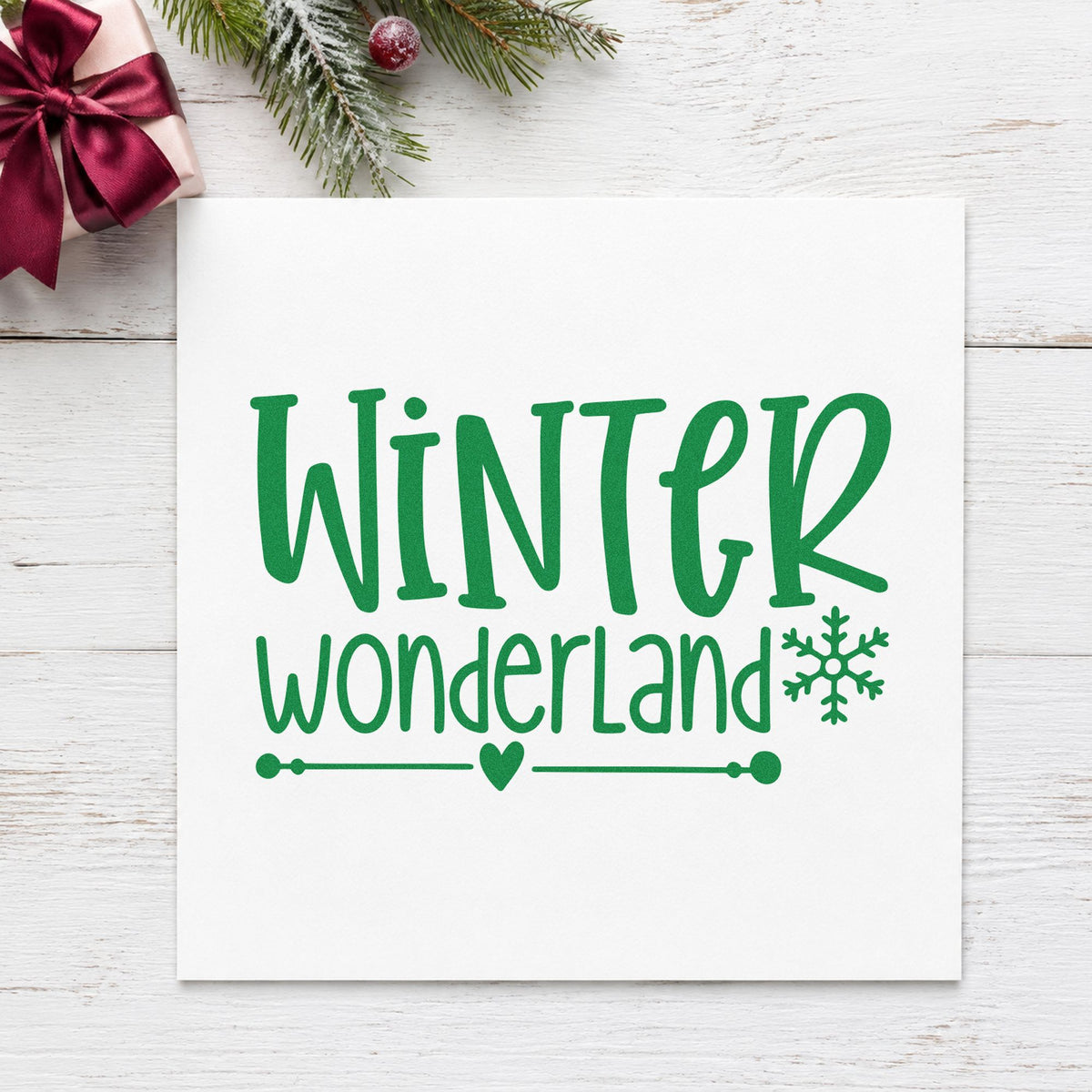 Winter Wonderland Snowflake craft stamp imprint in green ink on a handmade project, one idea being slim band gift tags.