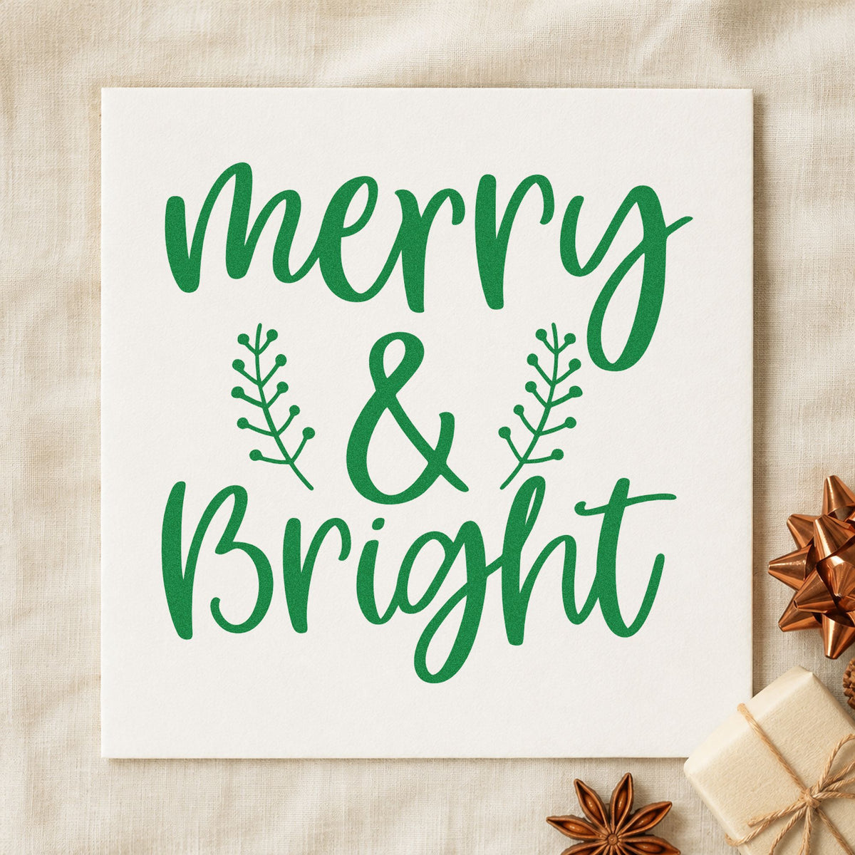 Merry And Bright Leafy Sprigs craft stamp imprint in green ink on a handmade project, one idea being twin gift tags.