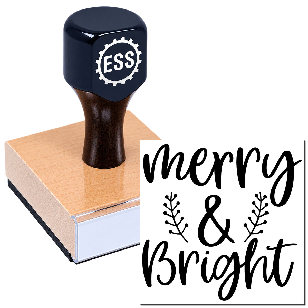 Dark navy ESS stamp and seal on a wooden block with black "merry & bright" holiday lettering and leaf accents.