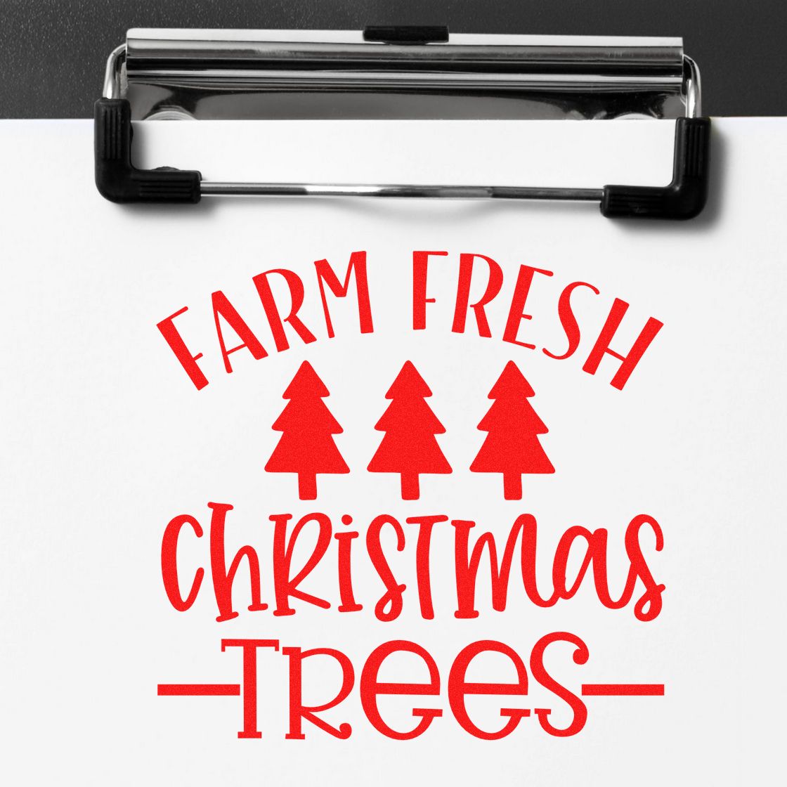 Red Farm Fresh Christmas Trees stamp with three tree icons on a white clipboard, showing a seal product.