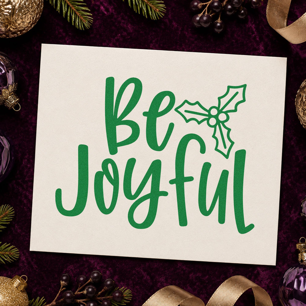 Be Joyful Holly craft stamp imprint in green ink on a handmade project, one idea being retreat table signs.