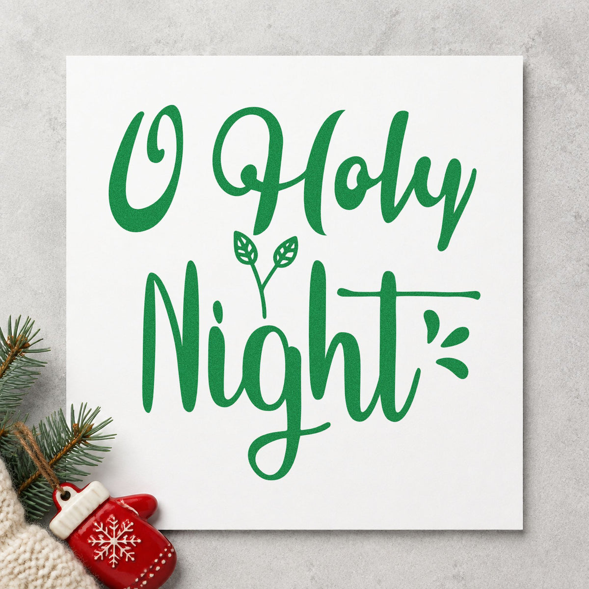 O Holy Night Leaves craft stamp imprint in green ink on a handmade project, one idea being organ score tags.