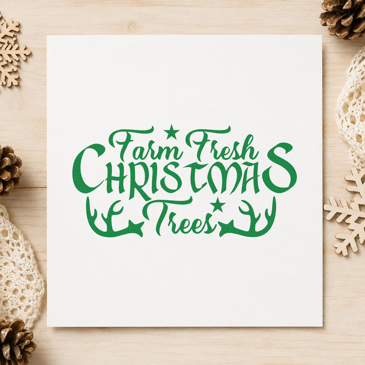 Farm Fresh Christmas Trees Antlers craft stamp imprint in green ink on a handmade project, one idea being stock sale gift tags.