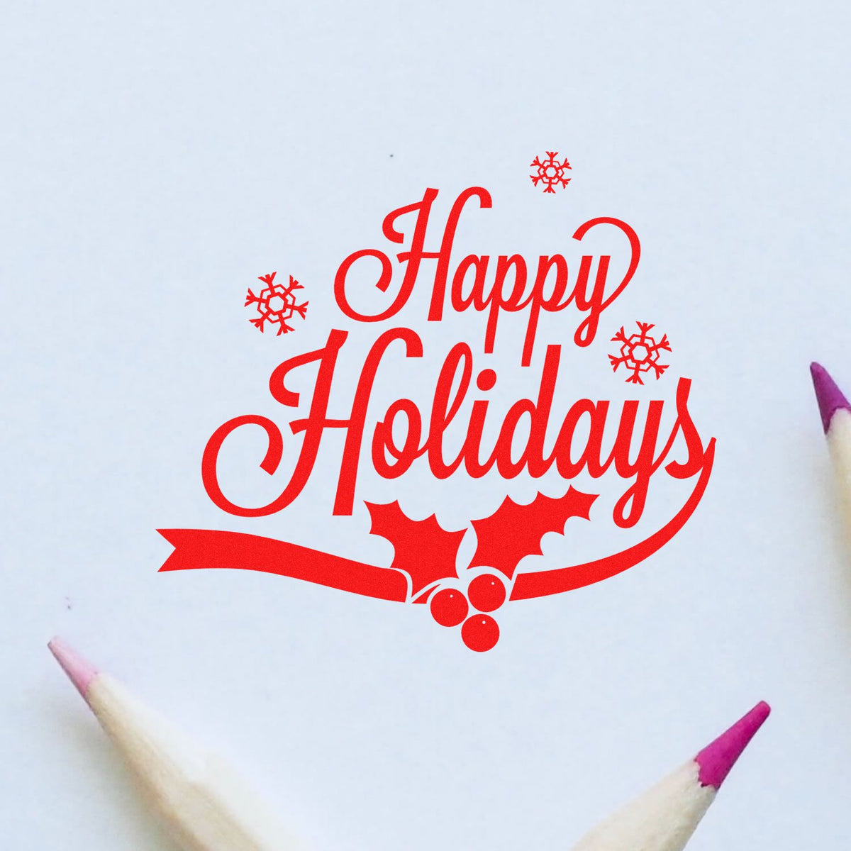 Red Happy Holidays stamp seal with snowflakes, holly, and ribbon on white paper