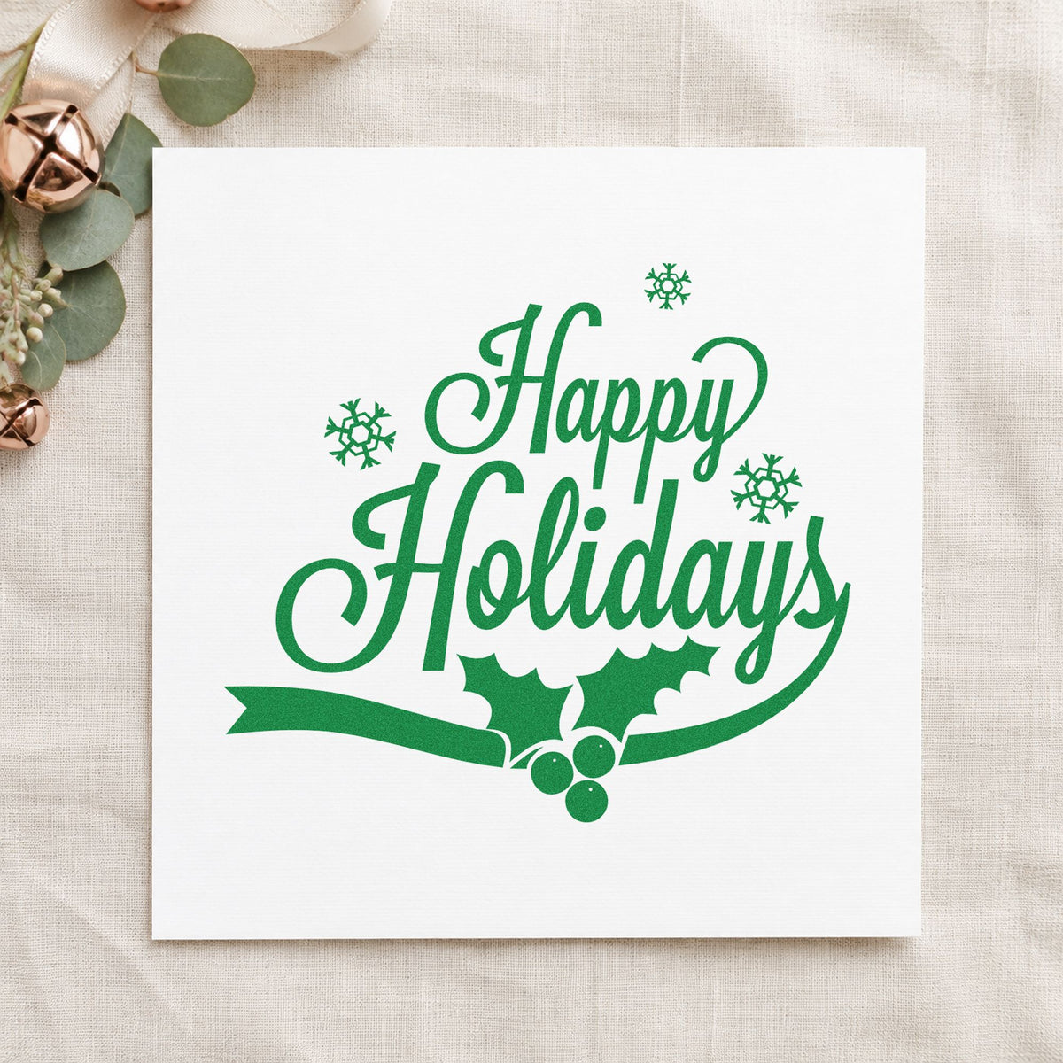 Happy Holidays Holly Ribbon craft stamp imprint in green ink on a handmade project, one idea being streamer gift tags.