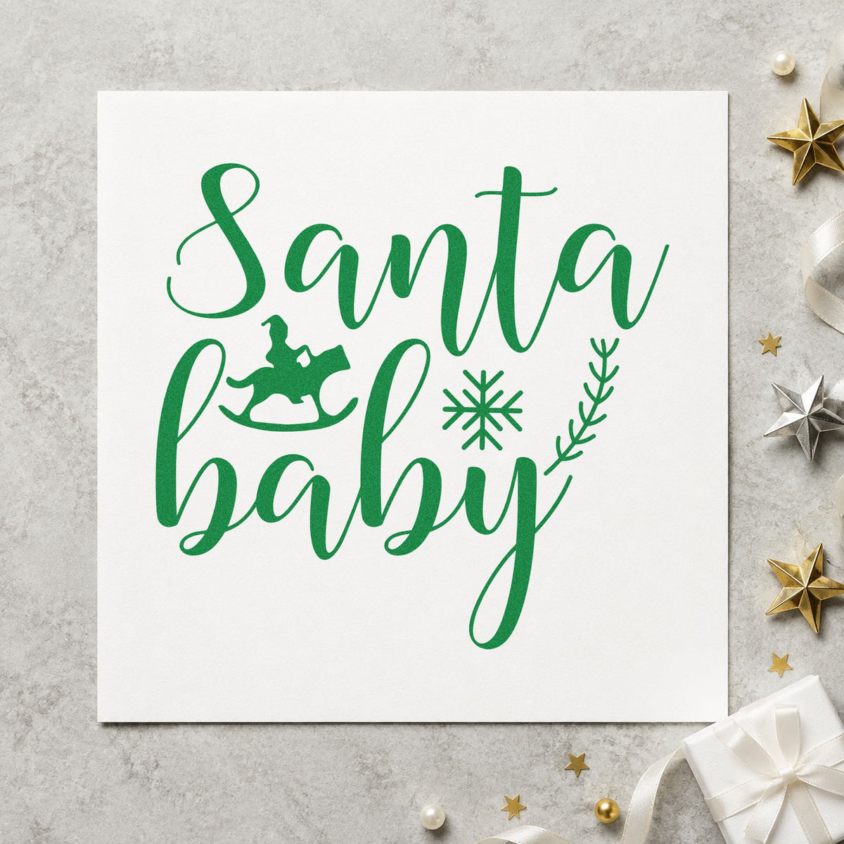 Santa Baby Rocking Horse craft stamp imprint in green ink on a handmade project, one idea being wooden block gift tags.