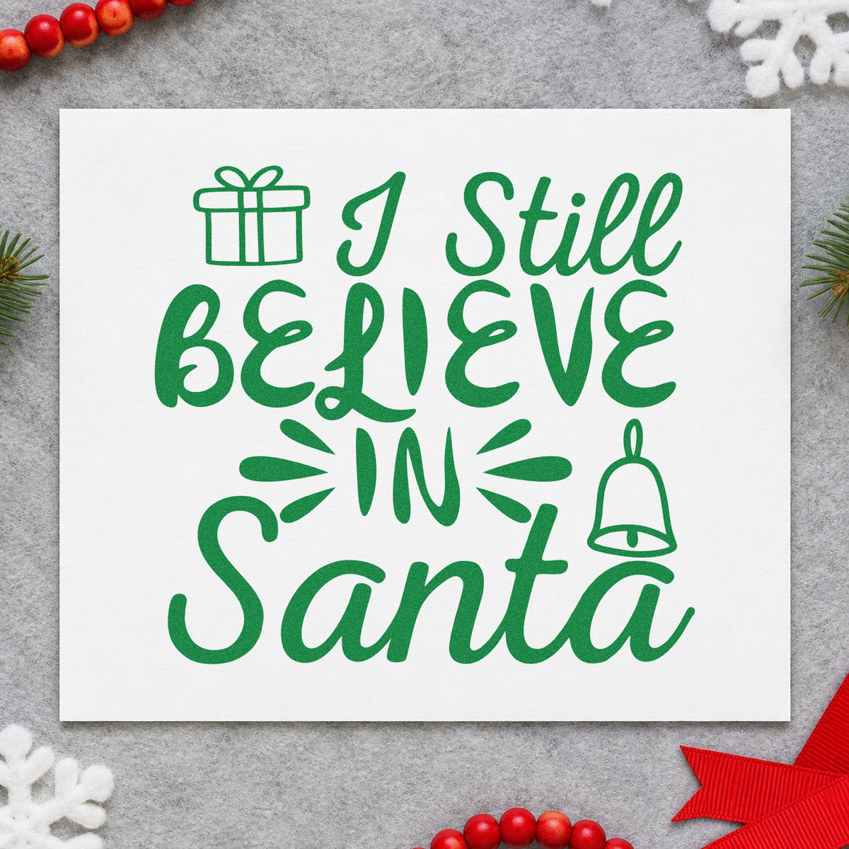 I Still Believe In Santa craft stamp imprint in green ink on a handmade project, one idea being keepsake gift tags.