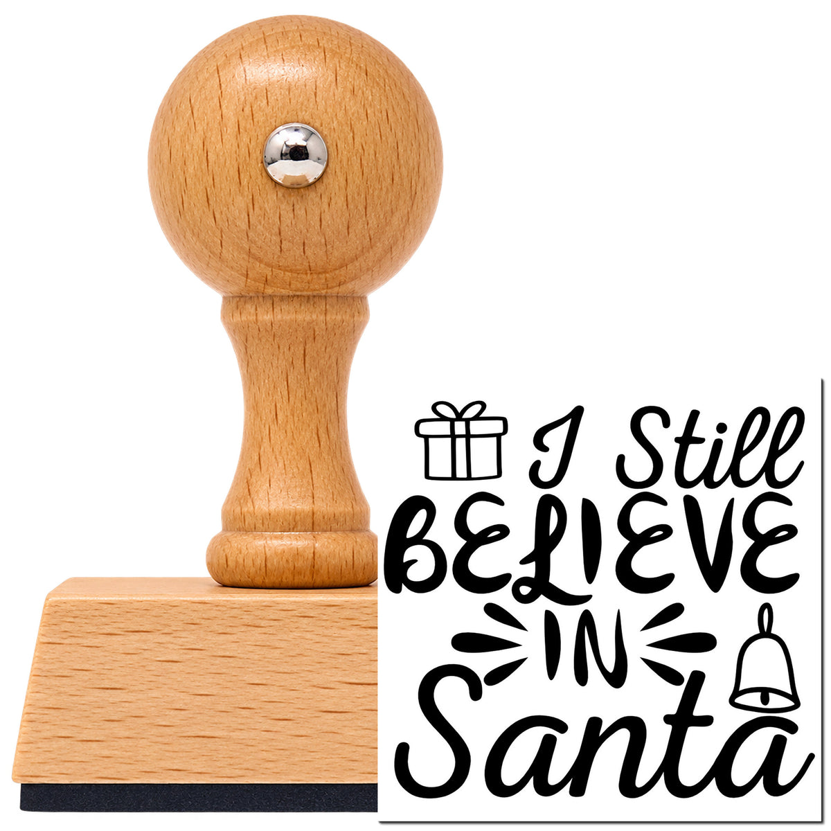 Vintage Pro beech wood stamp with a round knob handle, shown with its black I Still Believe In Santa imprint on white.