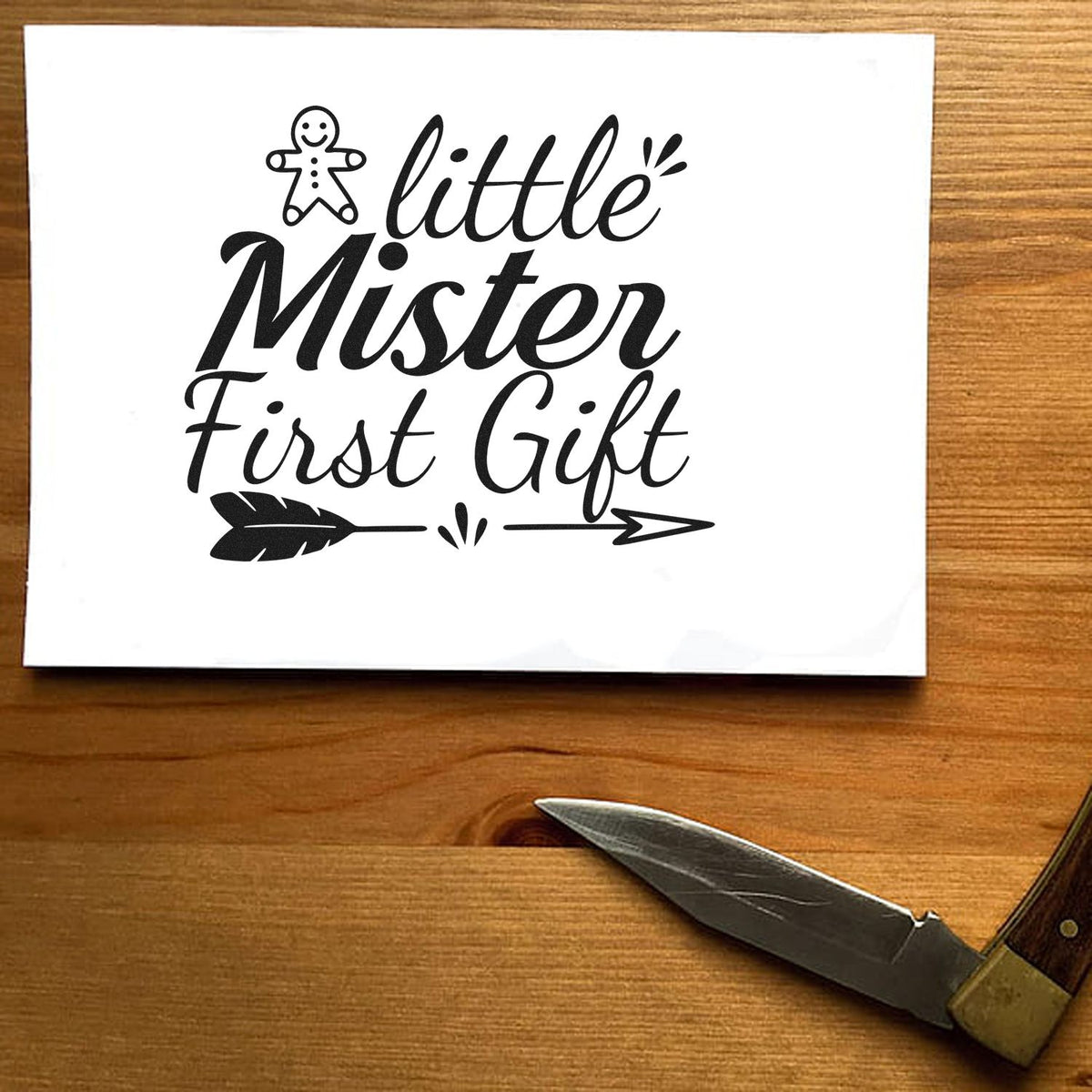 Black Little Mister First Gift stamp and seal design with gingerbread icon, arrow, and white background.