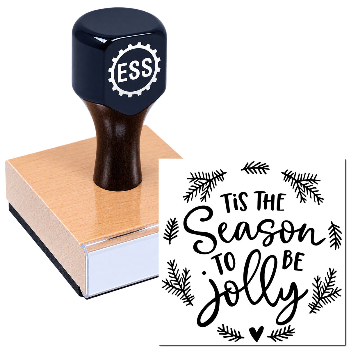Black ESS rubber stamp on a wood block beside a white holiday seal design with black "Tis the Season to Be Jolly" and pine branches.
