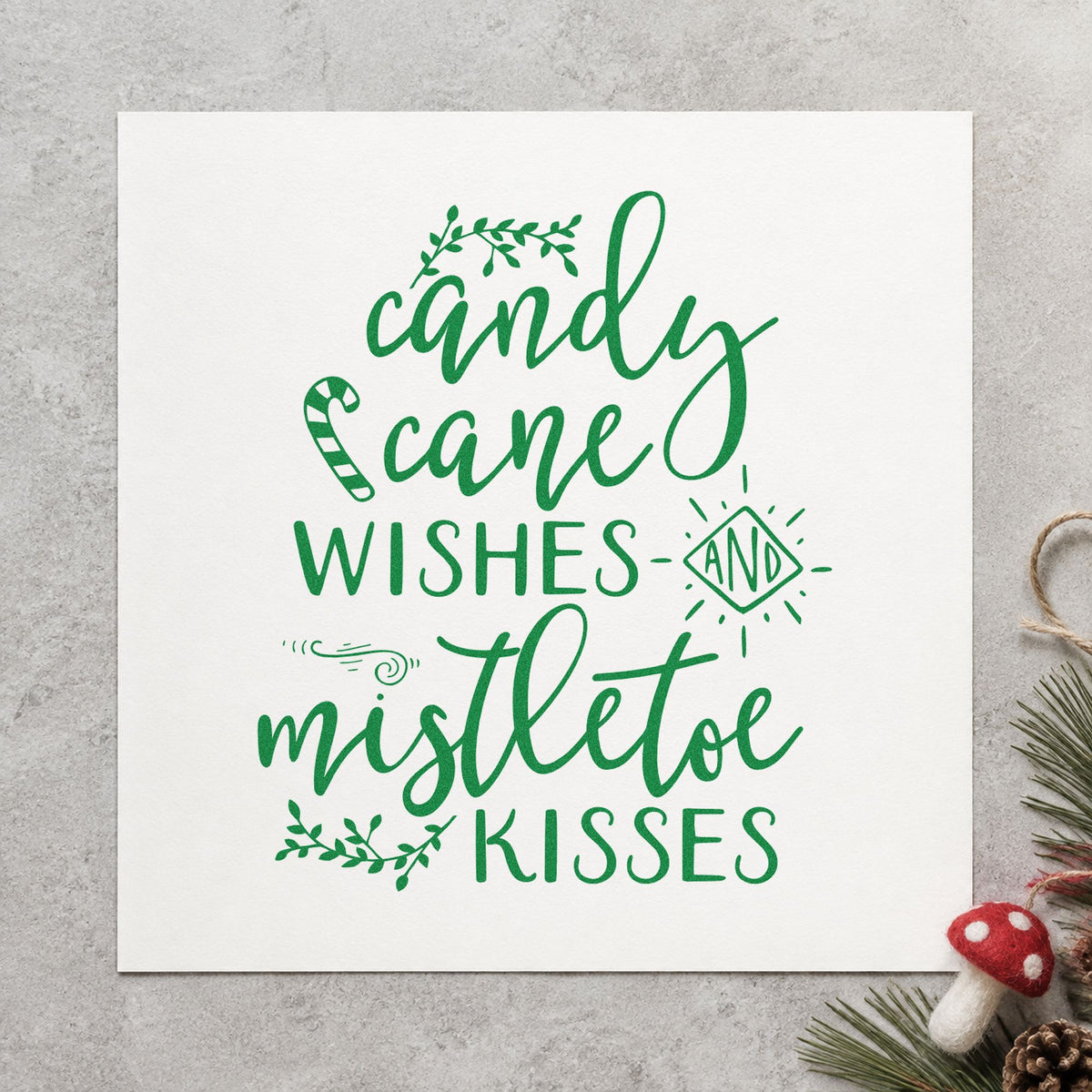 Candy Cane Mistletoe Wishes craft stamp imprint in green ink on a handmade project, one idea being kissing booth cards.