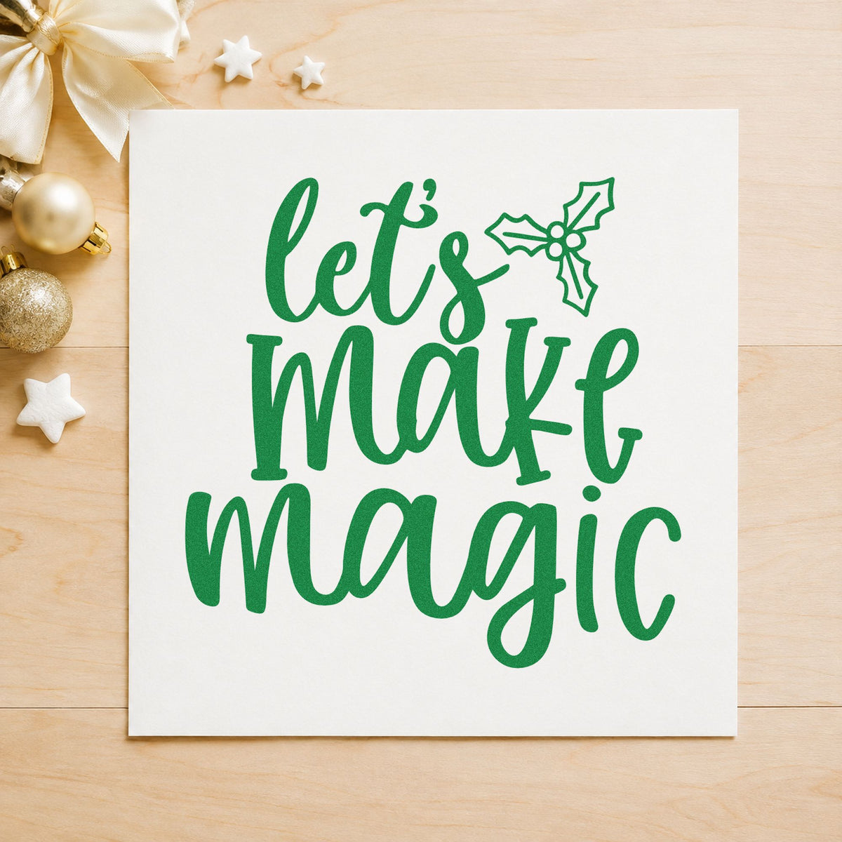 Let's Make Magic Holly craft stamp imprint in green ink on a handmade project, one idea being maker night cards.