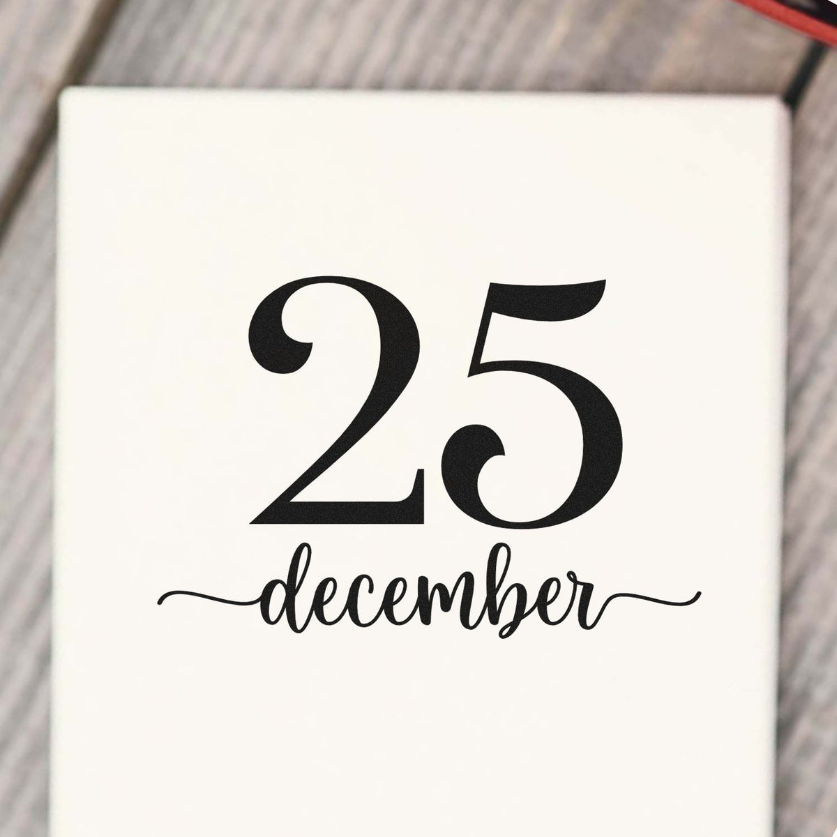 Black 25 December stamp and seal design on white background, with bold numerals and elegant script.