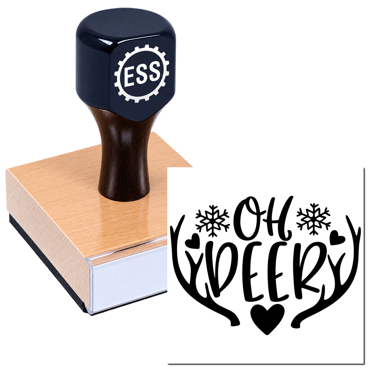 Black ESS rubber stamp and seal on a wood block, showing a black "Oh deer" antler design with snowflakes and hearts.