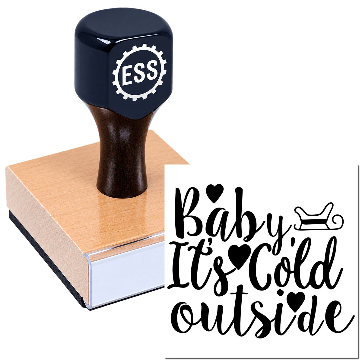 Dark navy ESS stamp with pink wooden base, showing black "Baby It's Cold Outside" seal with hearts and sled icon.