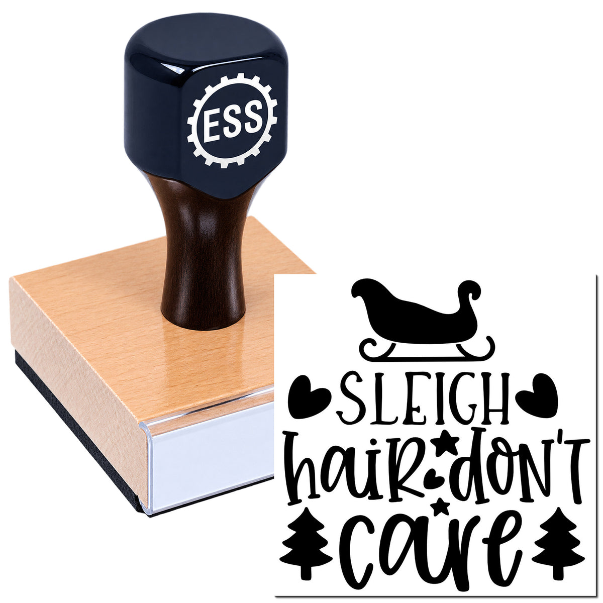 Dark navy self-inking stamp on a pink wooden block, with black "Sleigh hair don't care" holiday seal design.