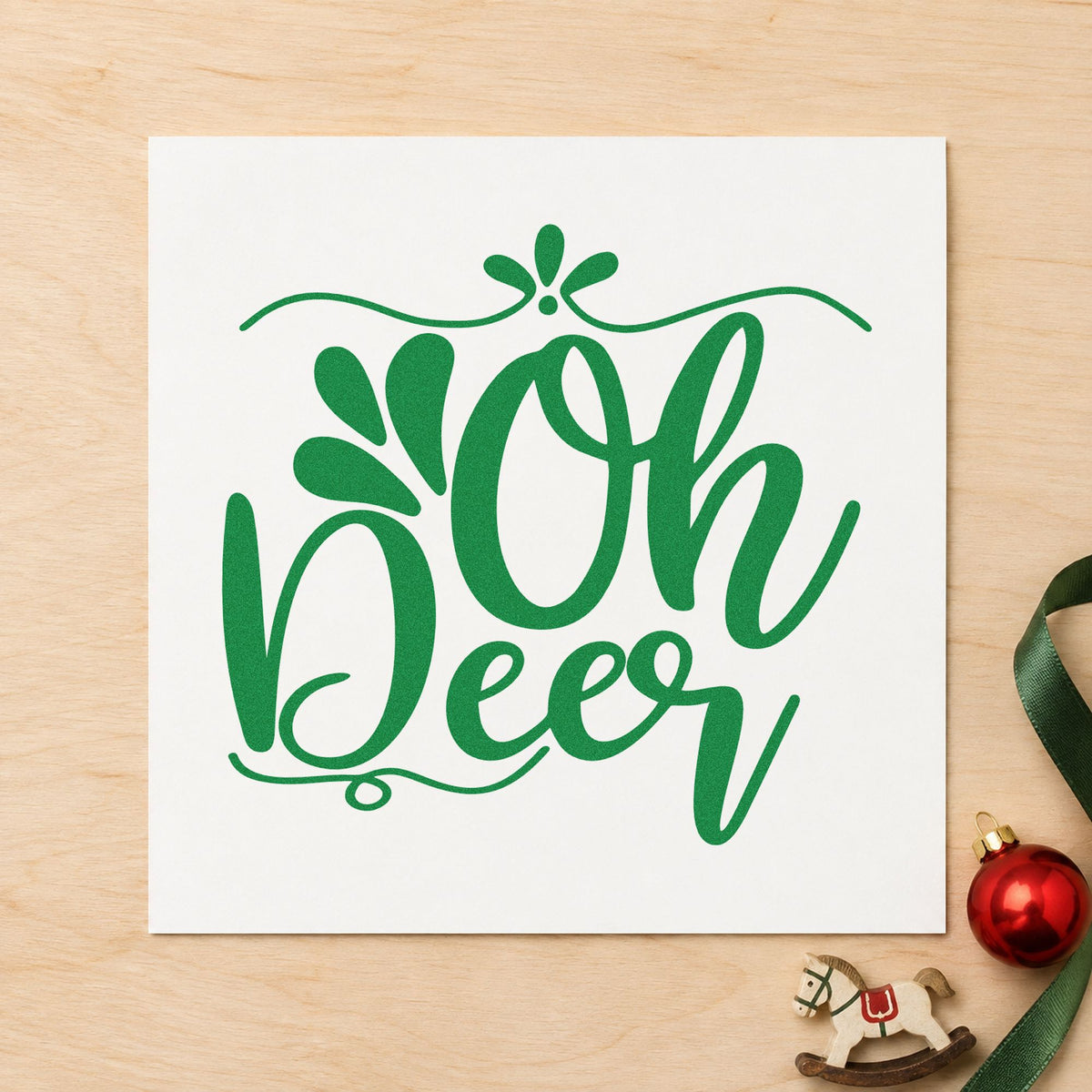 Oh Deer Ornamental Script craft stamp imprint in green ink on a handmade project, one idea being large format tags.