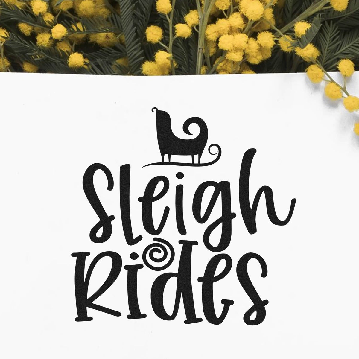 Black Sleigh Rides stamp and seal design with sleigh icon on white, framed by yellow flowers and green foliage.