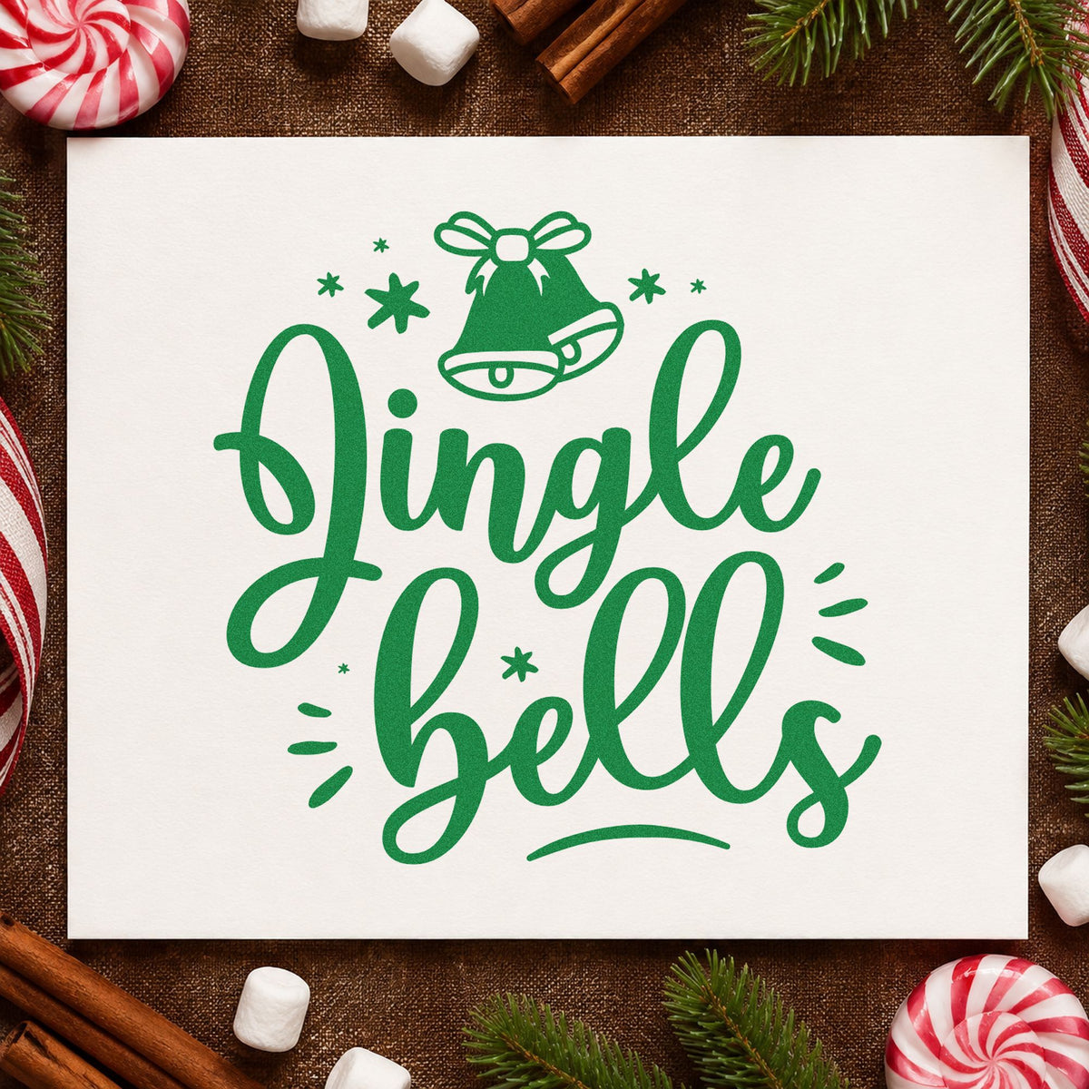 Jingle Bells Bow Bell craft stamp imprint in green ink on a handmade project, one idea being bell charm gift tags.