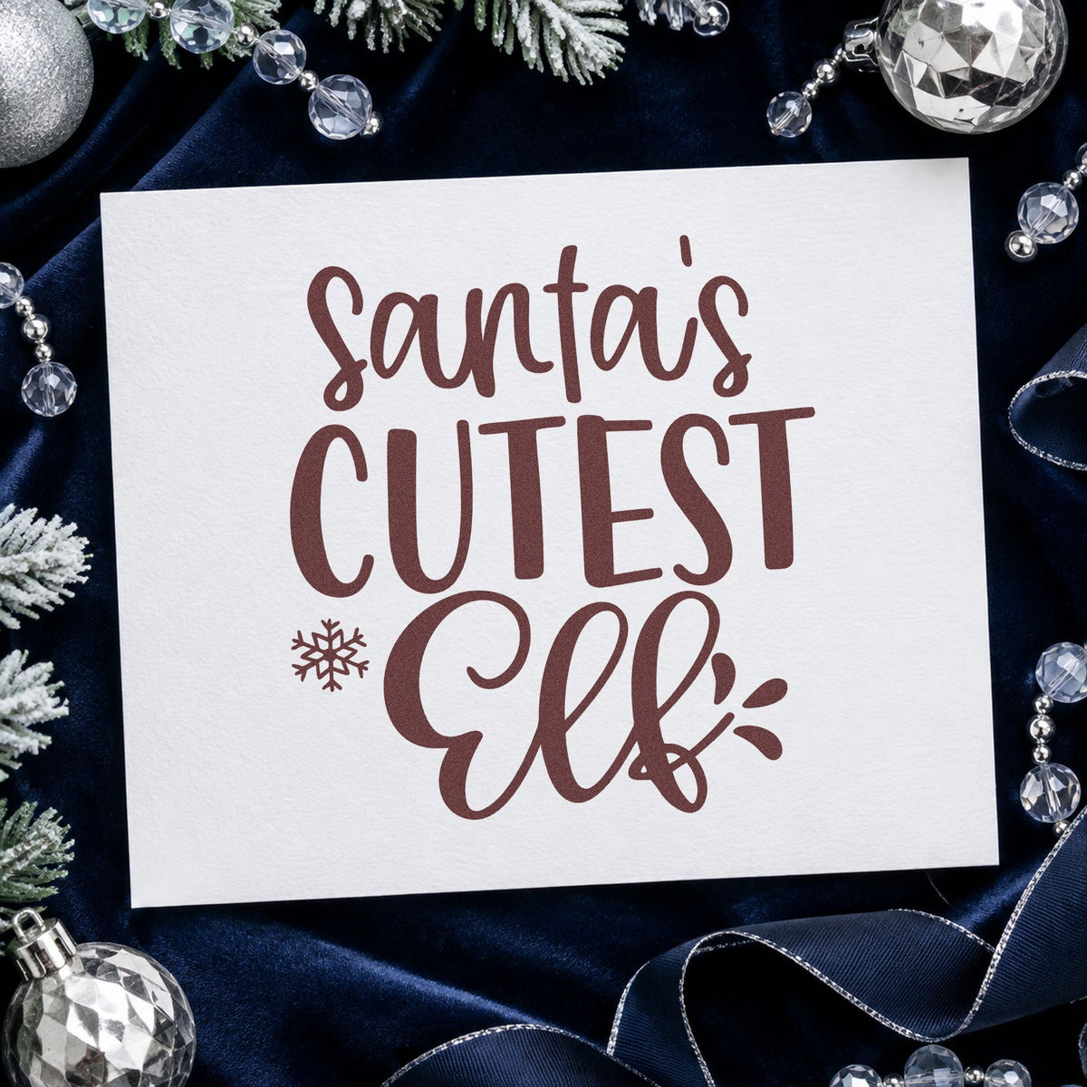 Santa's Cutest Elf Lettering rubber stamp printed in brown ink, ready for scrapbook photo pages and similar paper crafts.