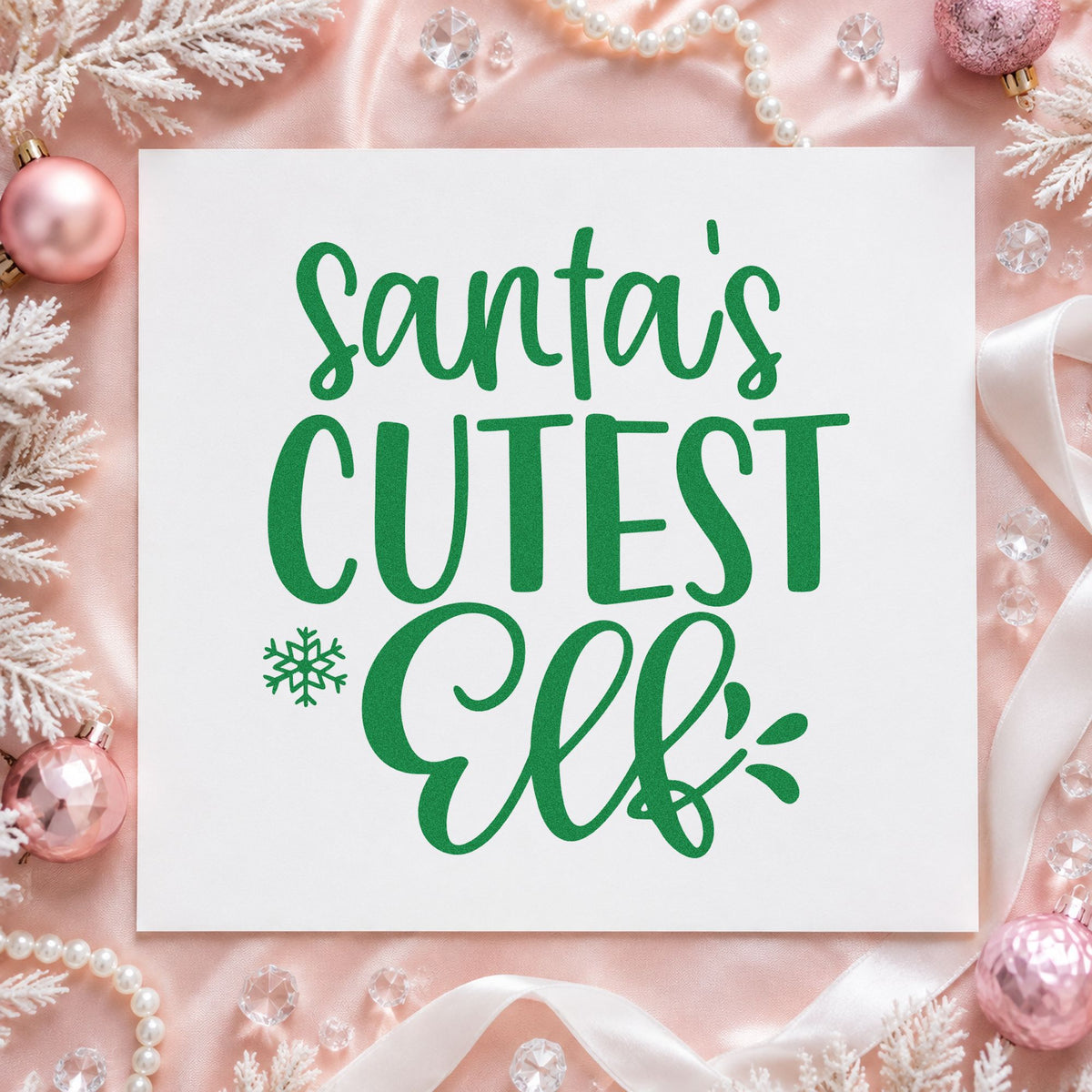 Santa's Cutest Elf Lettering craft stamp imprinted in green ink on paper, a design suited to classroom holiday treats.