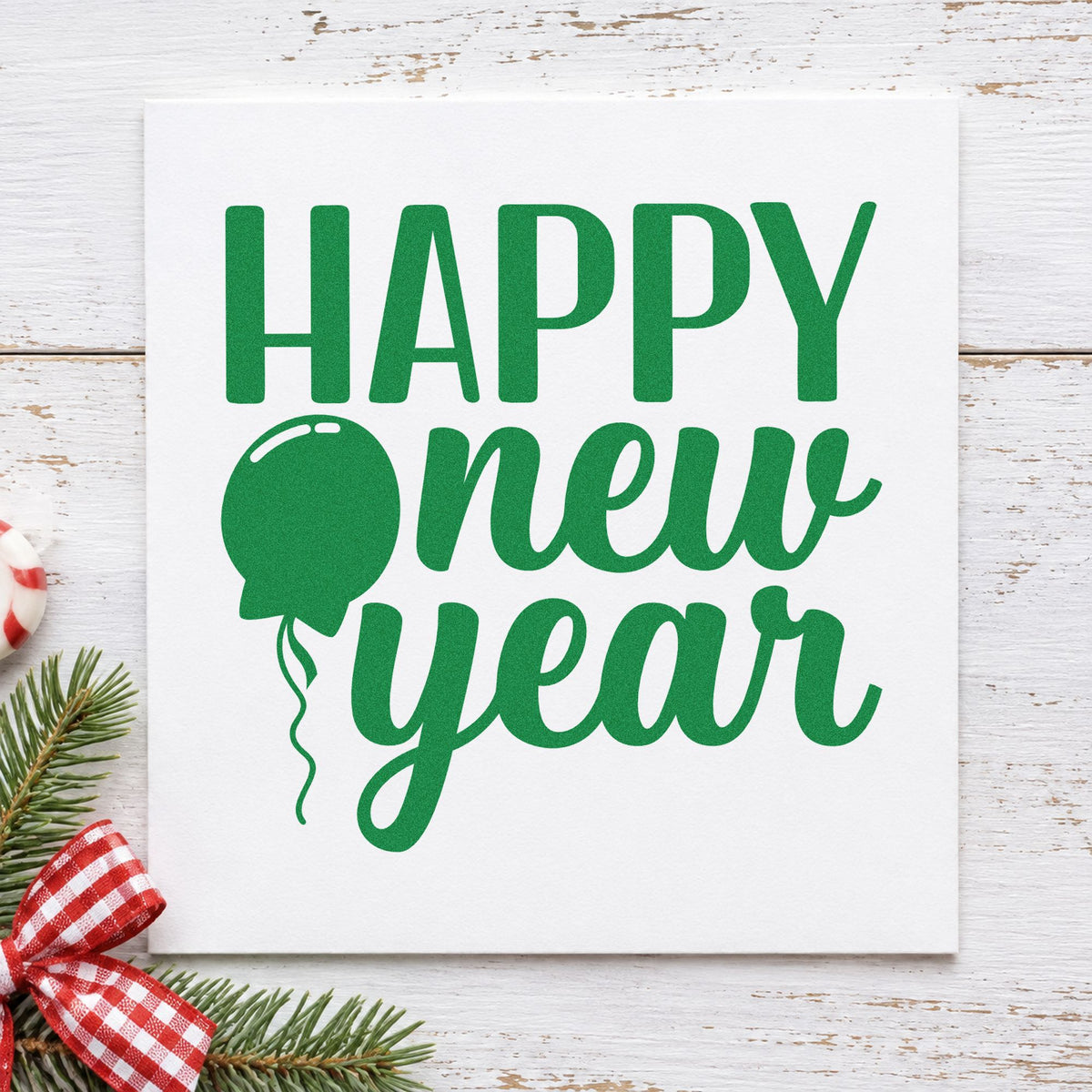 Happy New Year Balloon craft stamp imprinted in green ink on paper, a design suited to kids' countdown crafts.