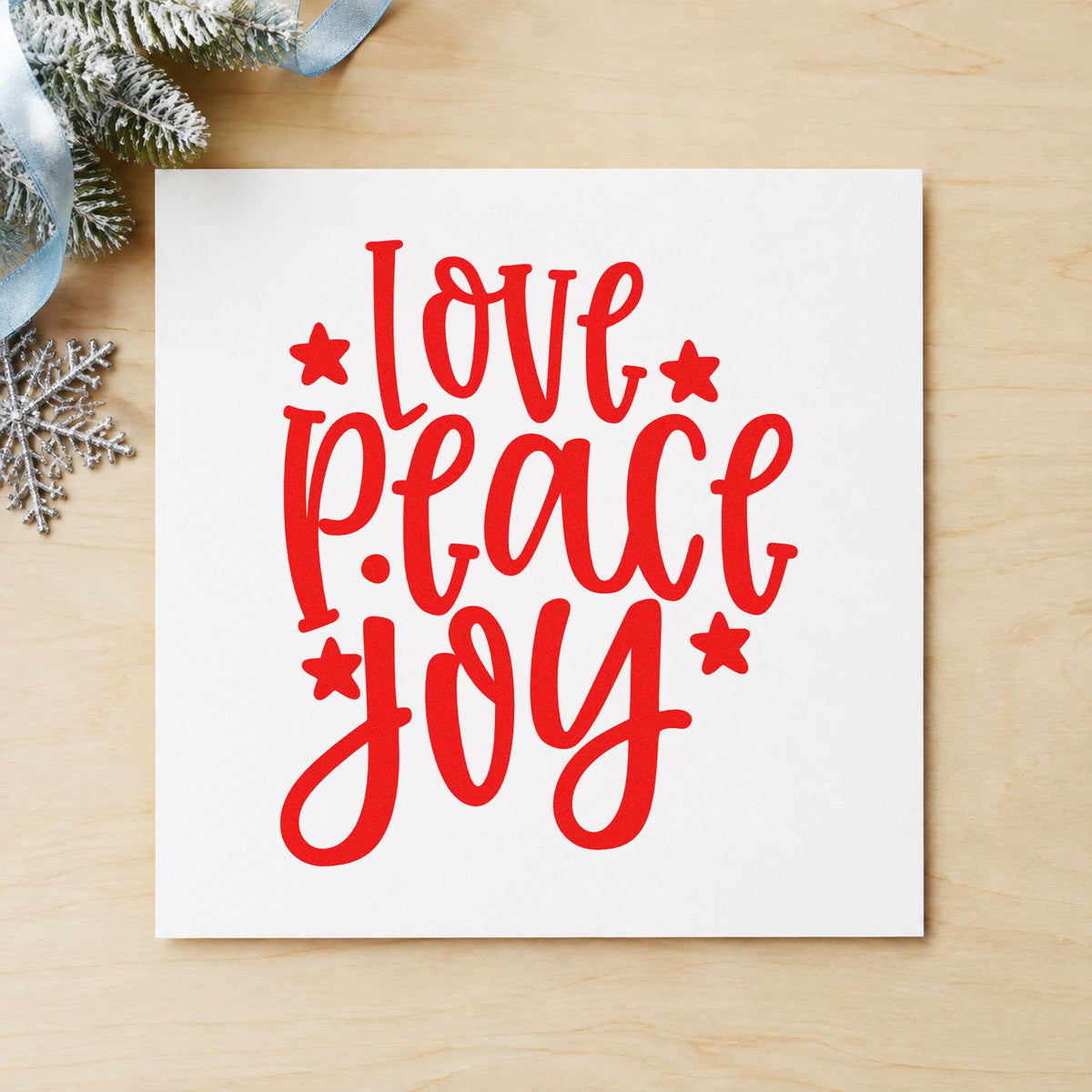 Love Peace Joy Stars craft stamp in red ink on cardstock, an easy option for sleeve stack printing.