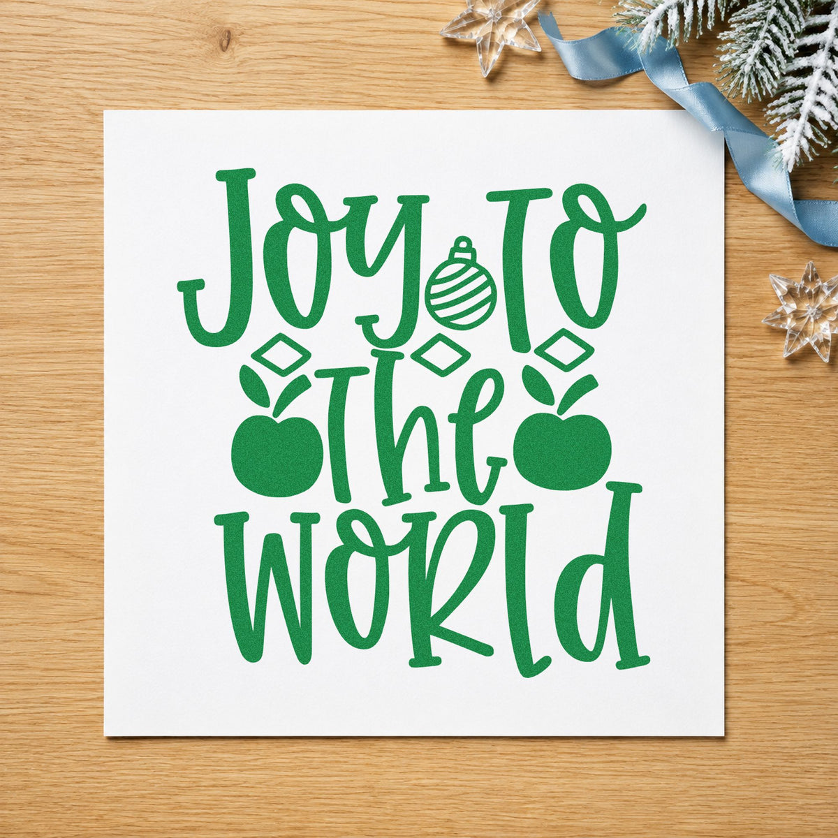 Joy To The World Ornaments craft stamp imprinted in green ink on paper, a design suited to framed window hang.