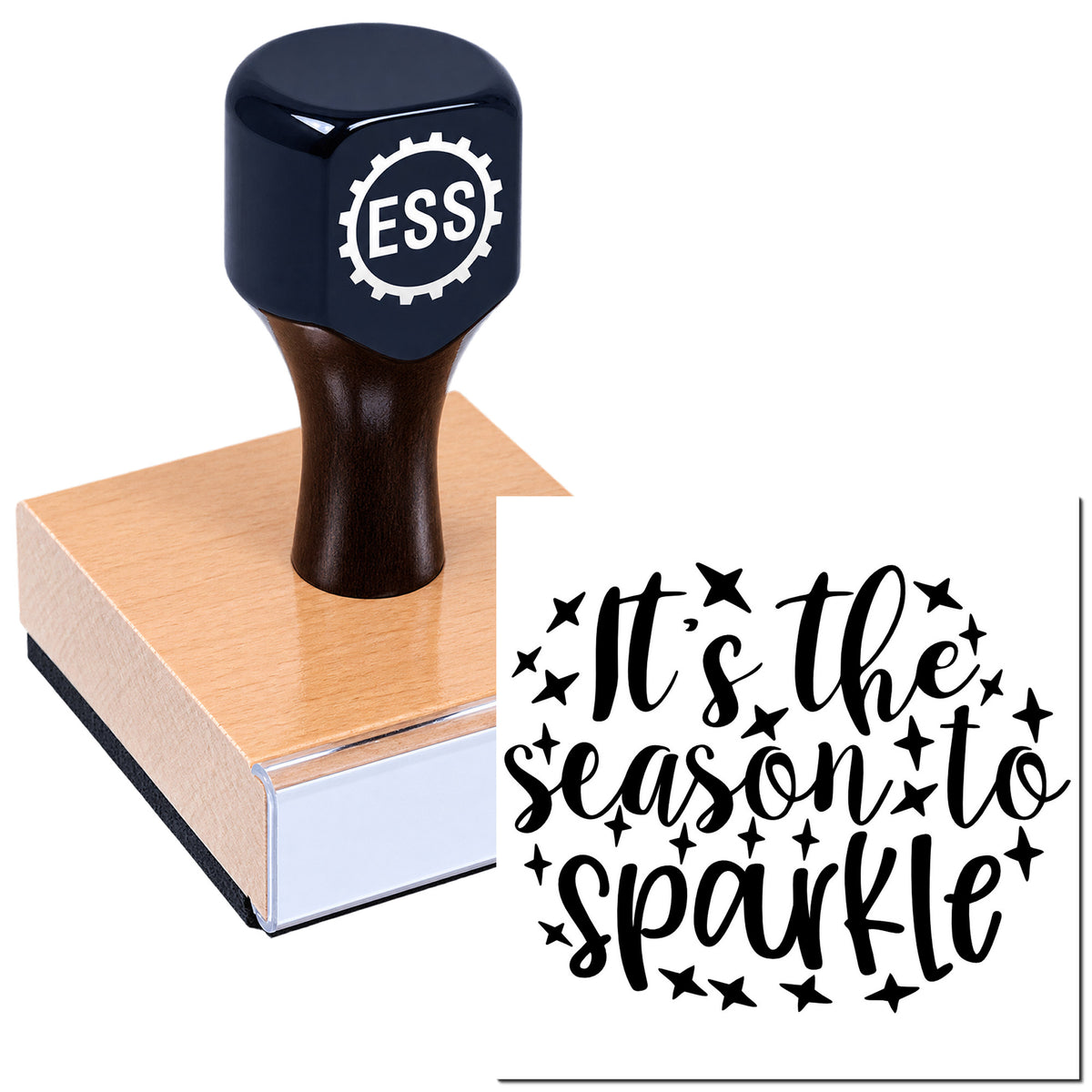 Navy rubber stamp with wooden base, making a black "It's the season to sparkle" seal with stars.