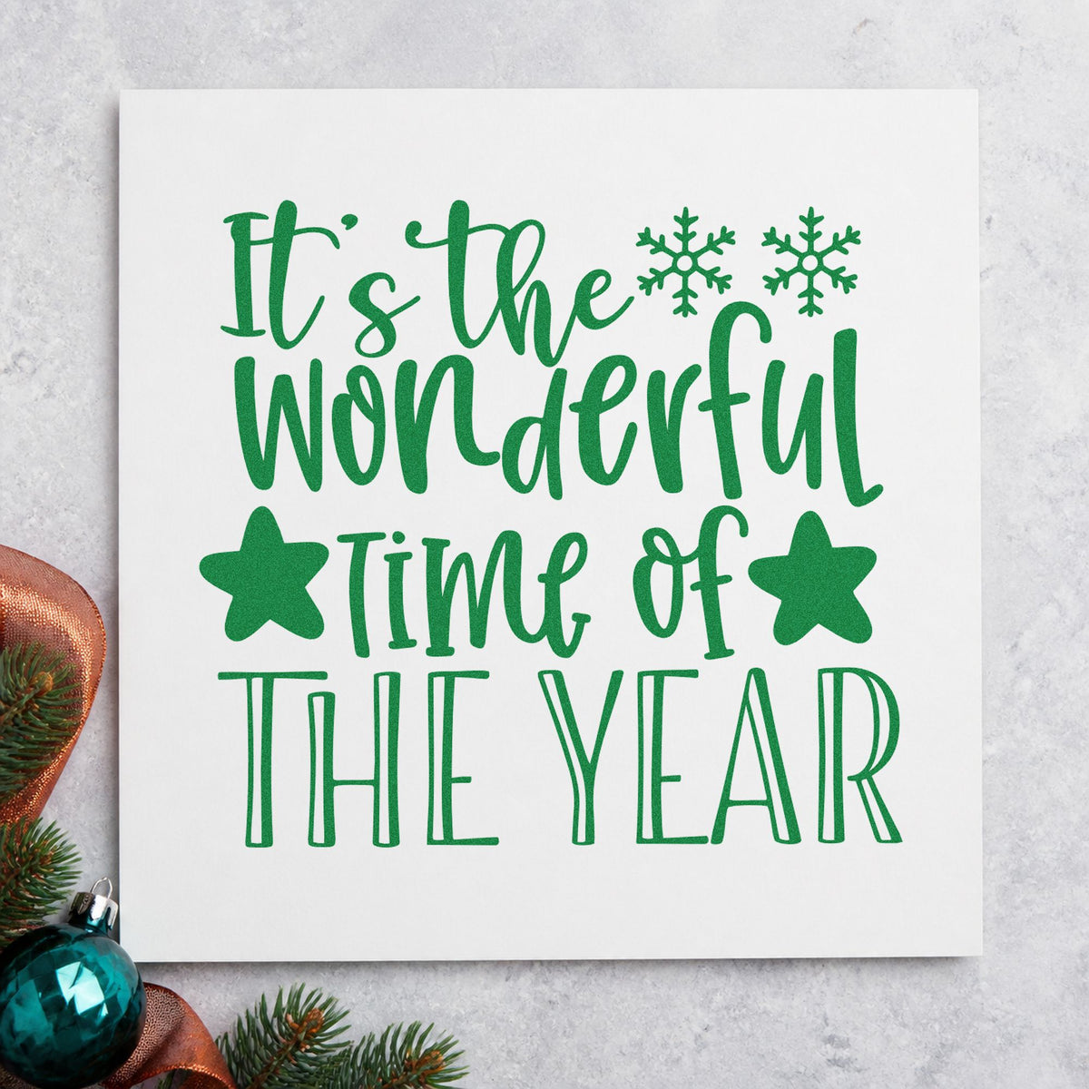Wonderful Time Of The Year craft stamp imprint in green ink on a handmade project, one idea being wrapped gift tags.