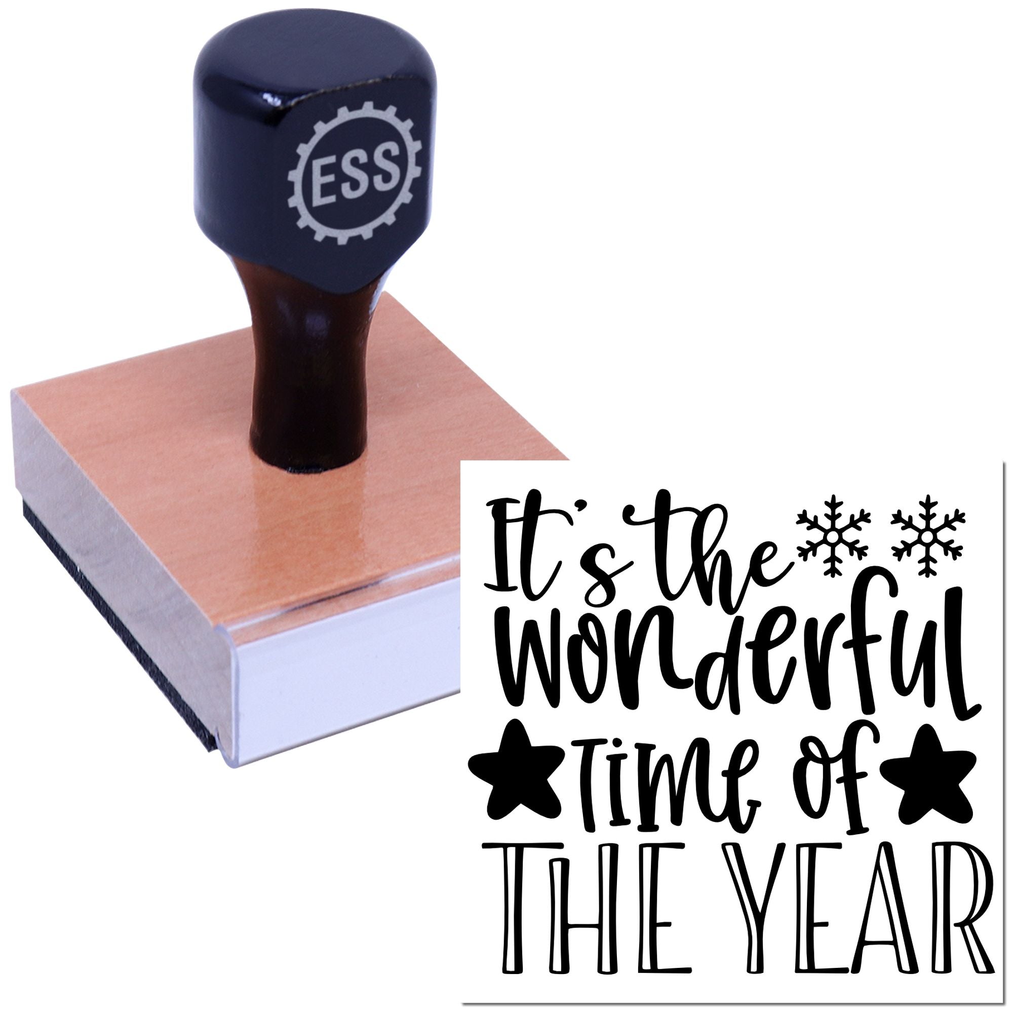 Black ESS stamp and seal on a wooden block, printing Its the wonderful time of the year with black snowflakes.