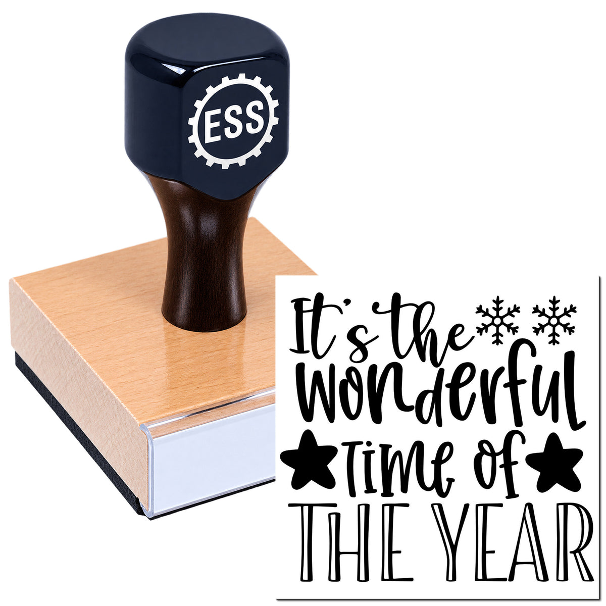 Black ESS stamp and seal on a wooden block, printing "It's the wonderful time of the year" with black snowflakes.
