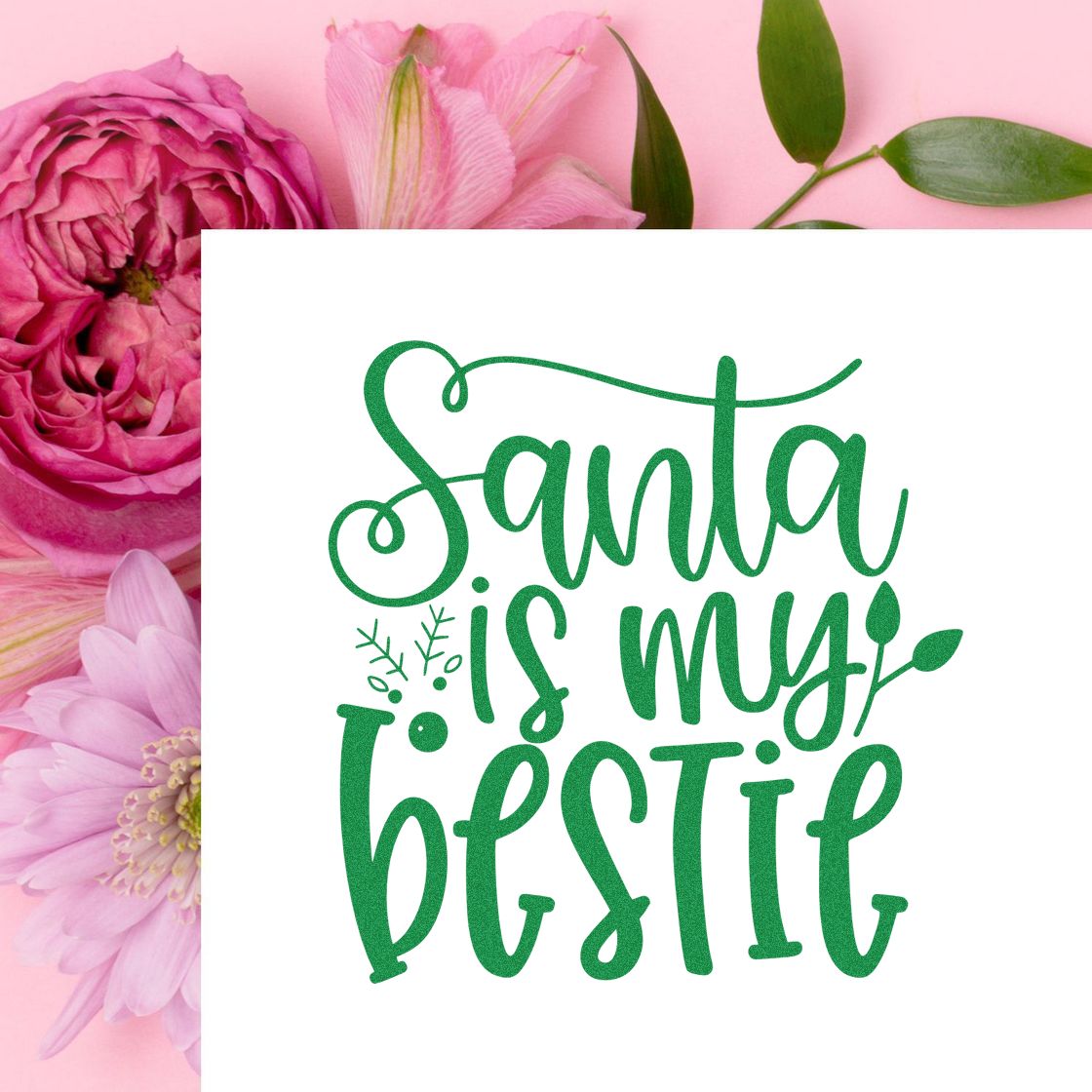 Green Santa is my bestie stamp/seal on white, surrounded by pink flowers and green leaves.