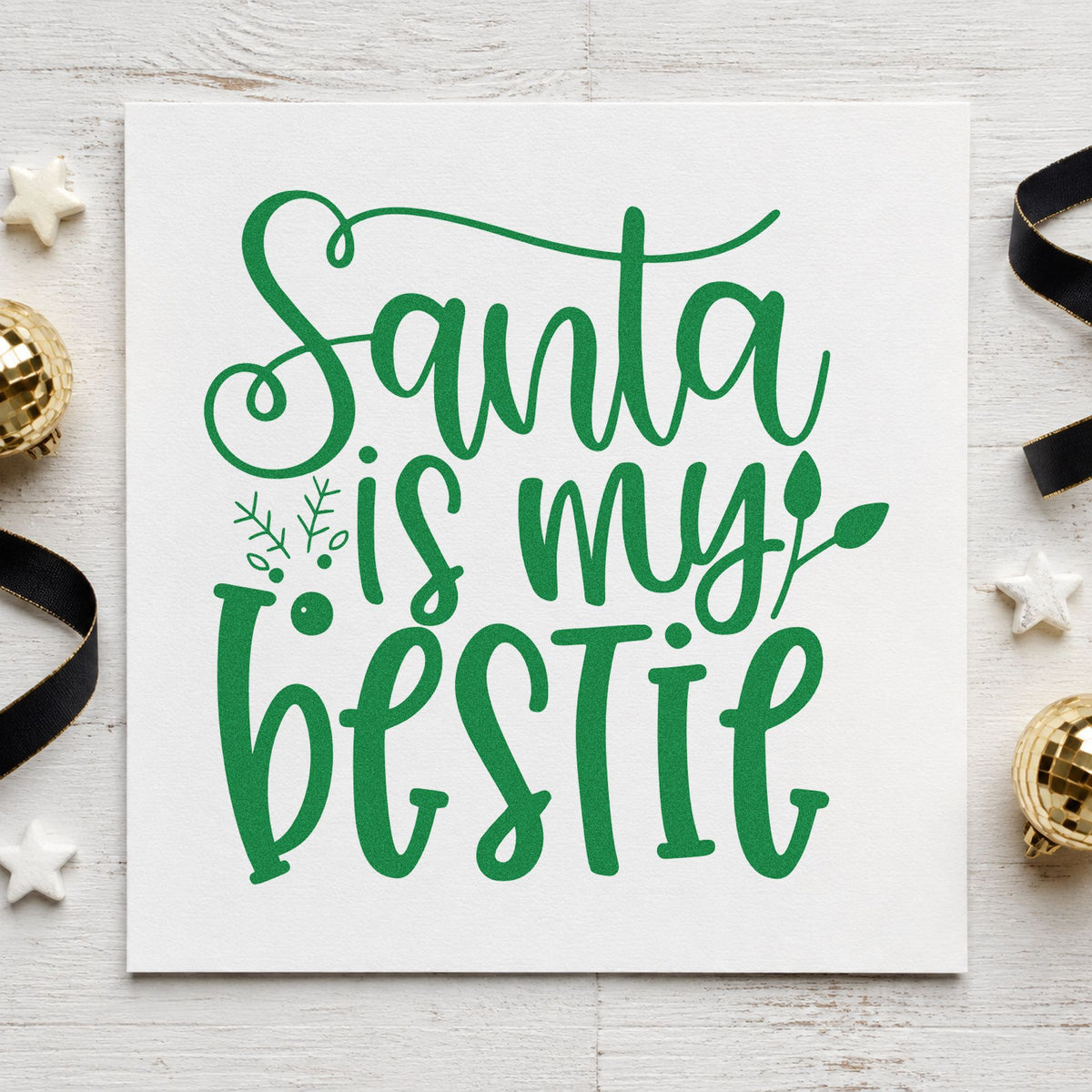 Santa Is My Bestie craft stamp imprint in green ink on a handmade project, one idea being group gift tags.