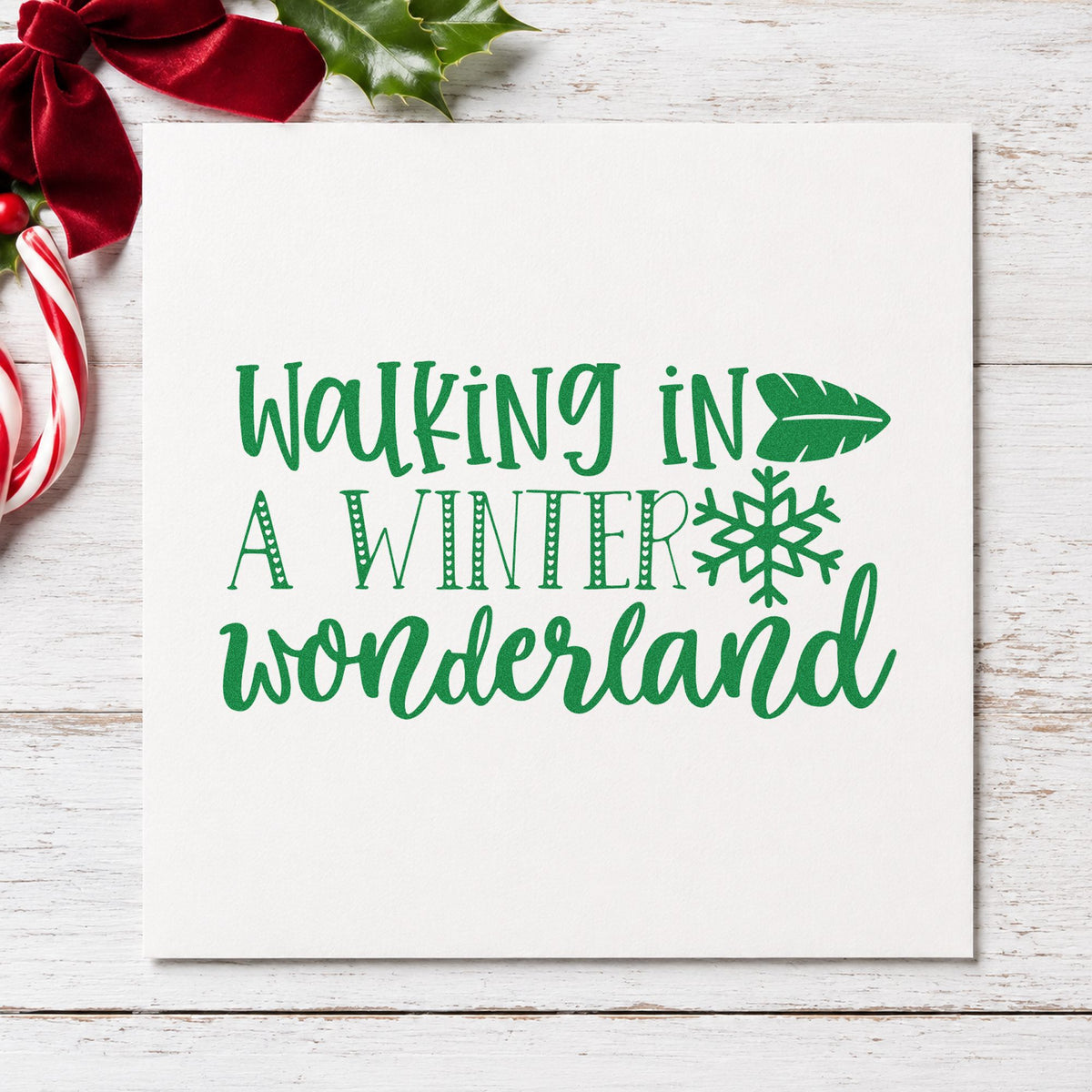 Walking In Winter Wonderland craft stamp imprint in green ink on a handmade project, one idea being pedometer gift tags.