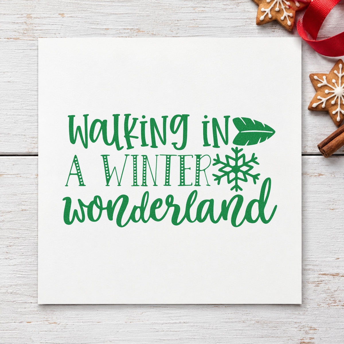 Walking In Winter Wonderland craft stamp imprint in green ink on a handmade project, one idea being group walk cards.