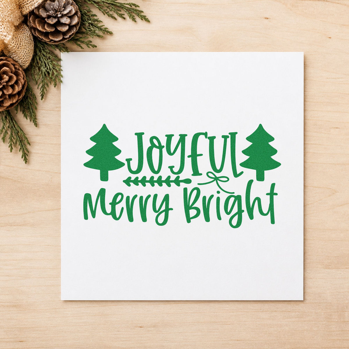 Joyful Merry Bright Trees craft stamp imprint in green ink on a handmade project, one idea being arrow split tags.
