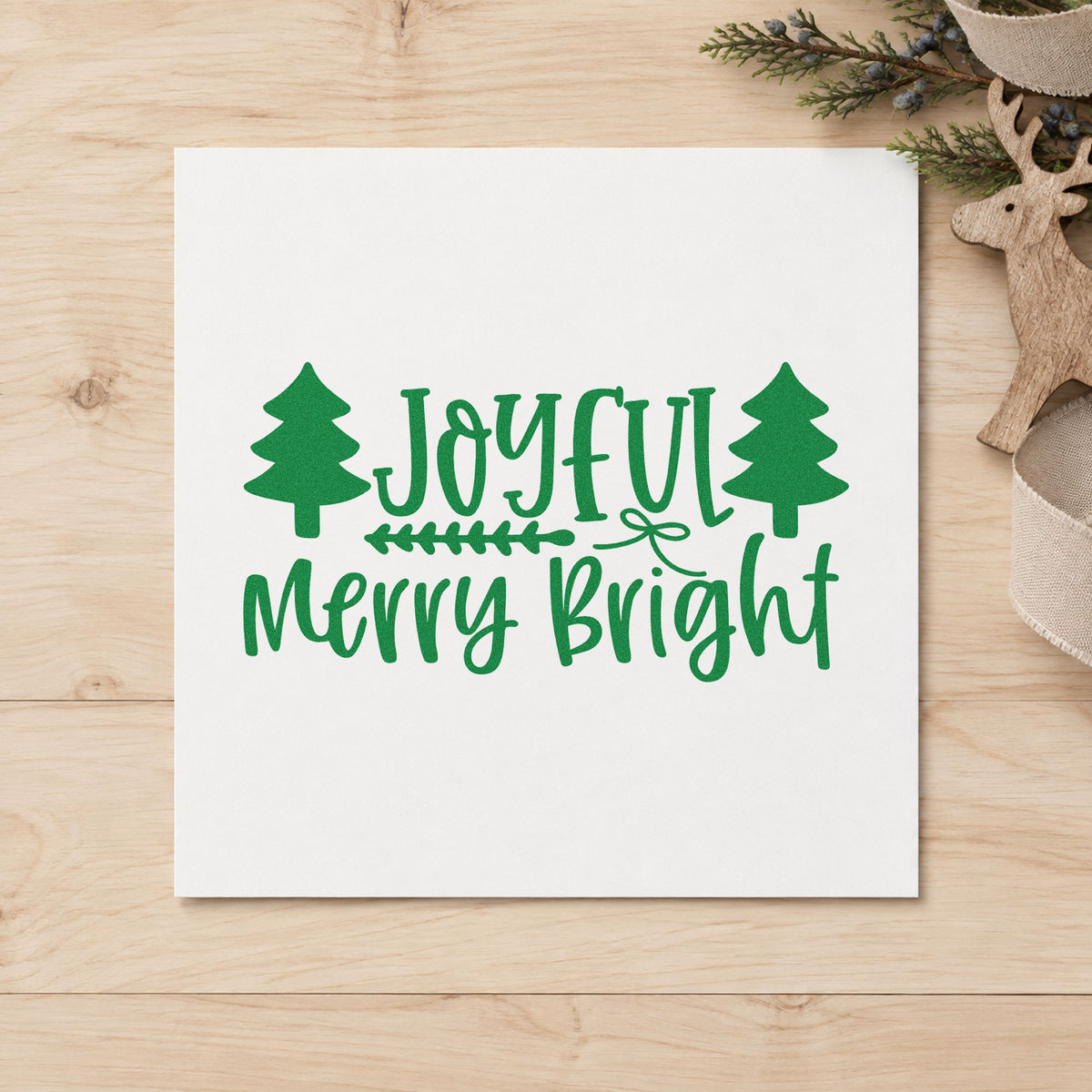 Joyful Merry Bright Trees craft stamp imprint in green ink on a handmade project, one idea being station order cards.