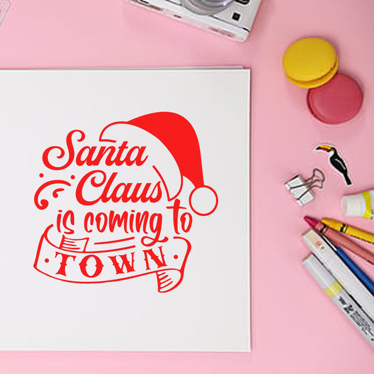 Red Santa Claus is coming to town custom stamp and seal on white card, with pink background, ink pads and markers