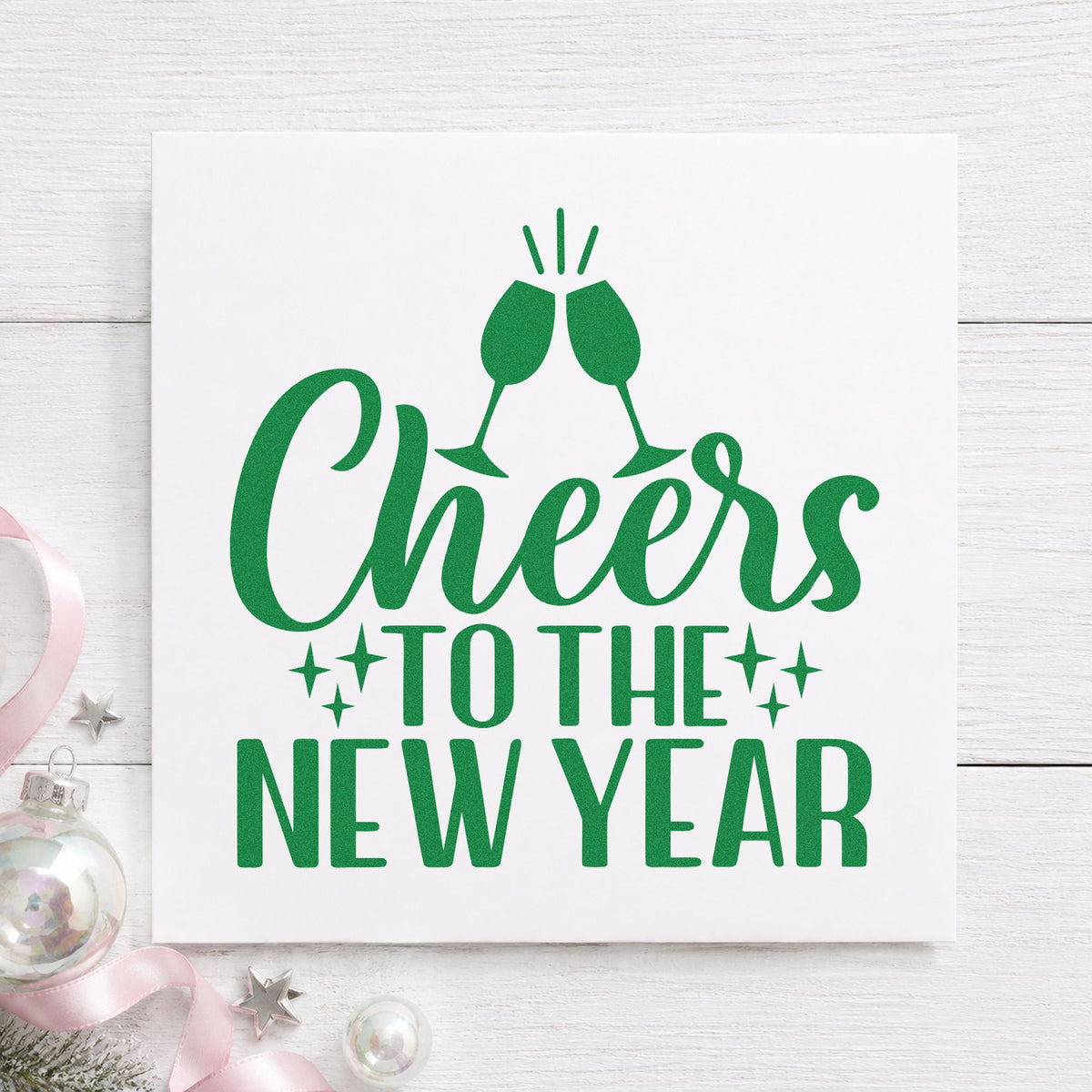 Cheers To The New Year craft stamp imprint in green ink on a handmade project, one idea being midnight menu cards.