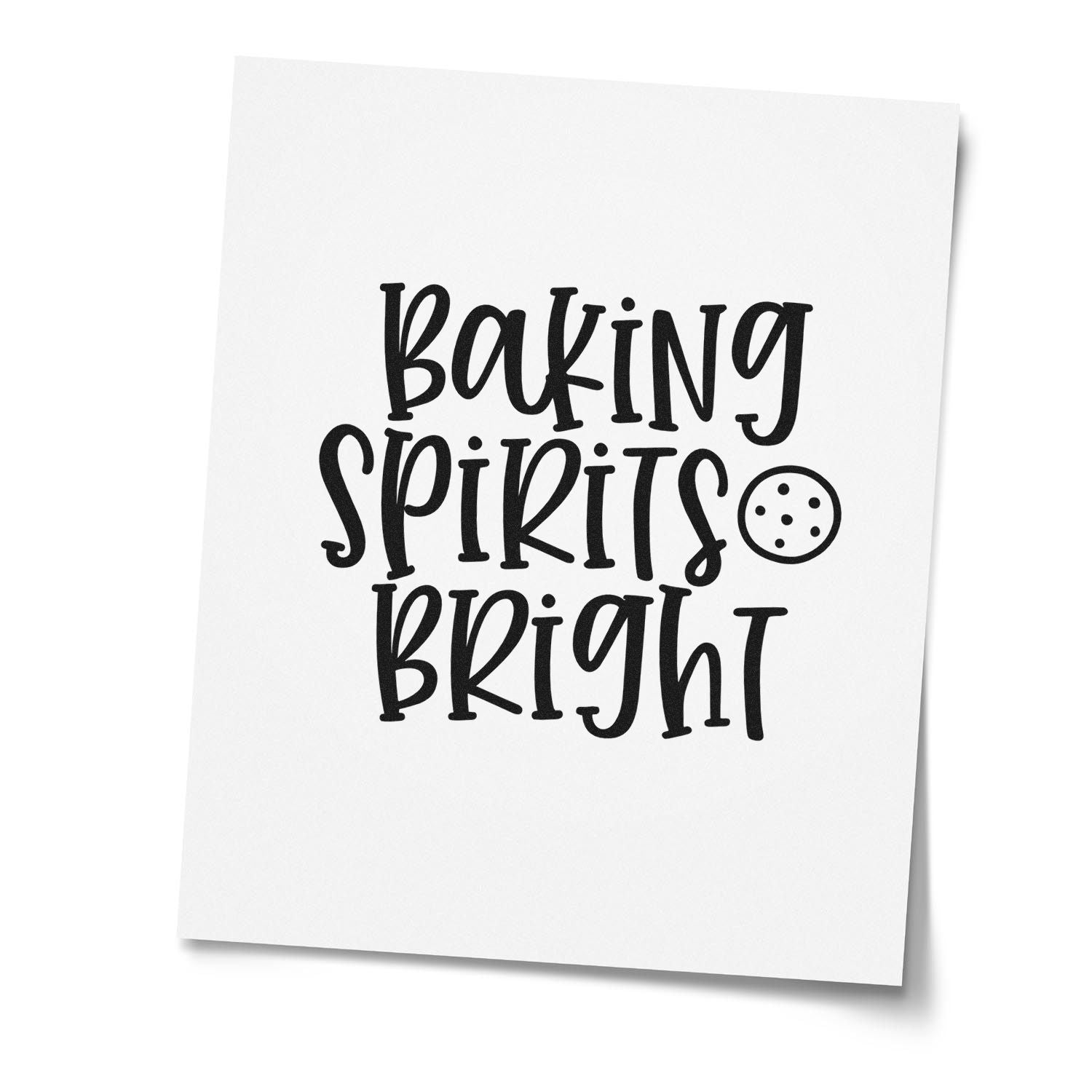 Black baking stamp and seal design on white card reading Baking Spirits Bright with a cookie icon.