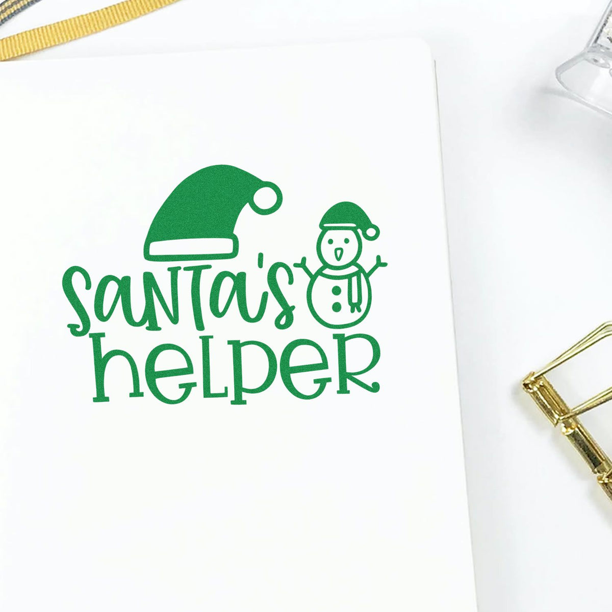 Green Santas helper stamp and seal with Santa hat and snowman on white background