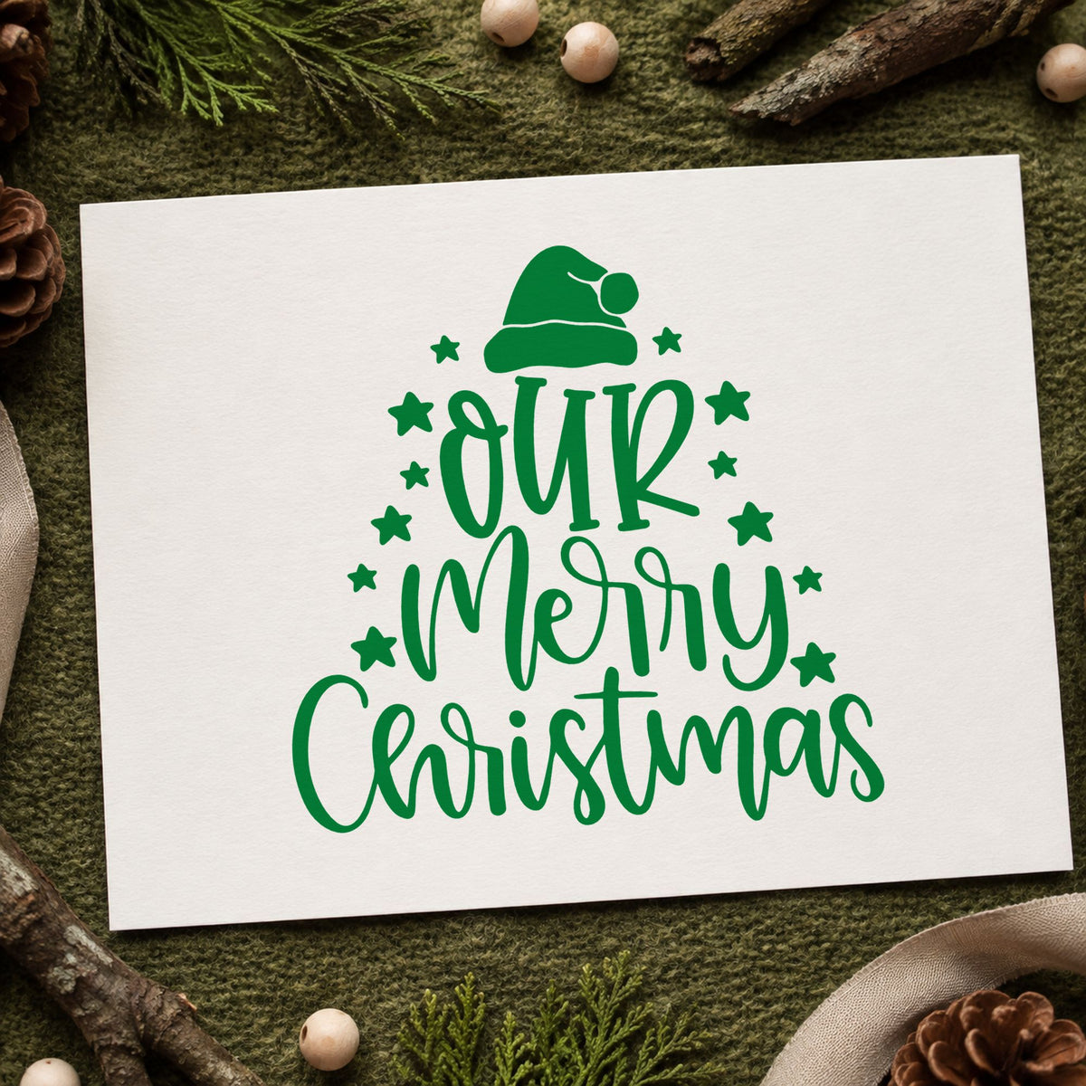 Our Merry Christmas Stars craft stamp imprint in green ink on a handmade project, one idea being wedge shape tags.