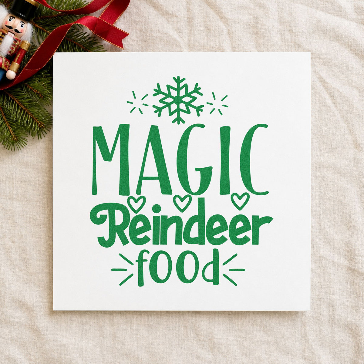 Magic Reindeer Food Snowflake craft stamp imprint in green ink on a handmade project, one idea being oat bag gift tags.