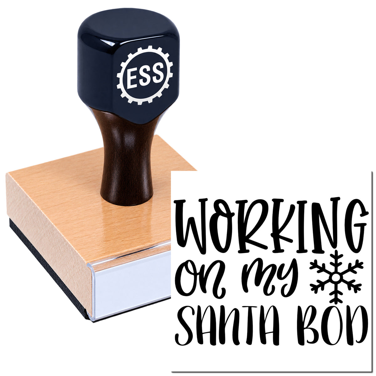 Dark blue self-inking stamp with wooden base, imprinting "WORKING ON MY SANTA BOD" and a snowflake icon.